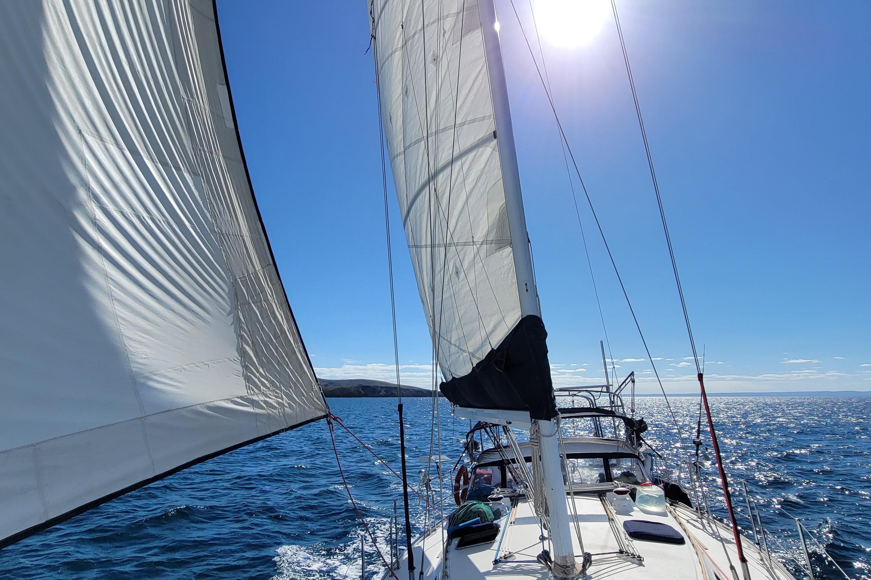Sailing a 1991 Catalina 42 MkII on a sunny day with clear blue skies.