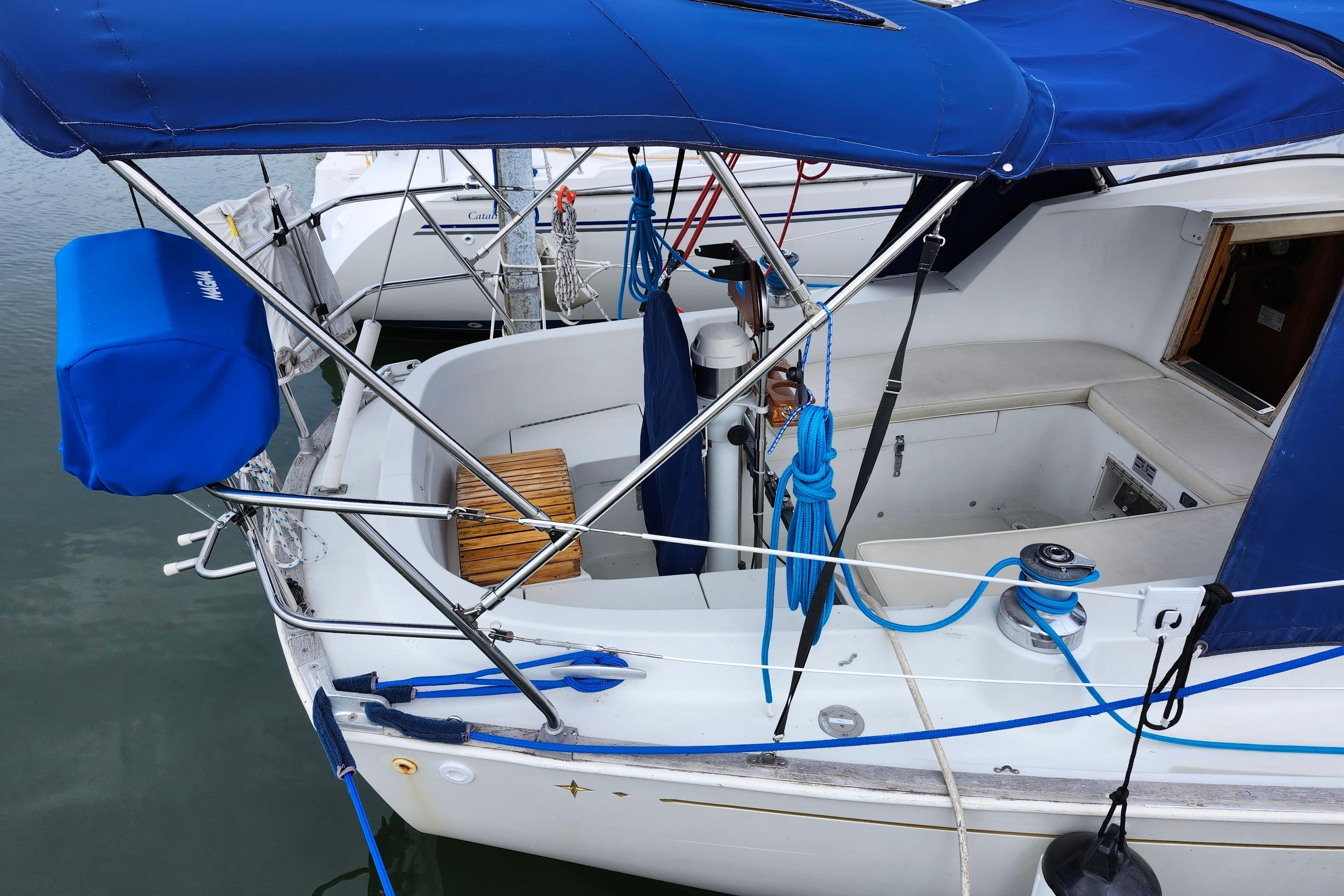 1982 C&C Landfall 35 sailboat with blue canopy and deck details.