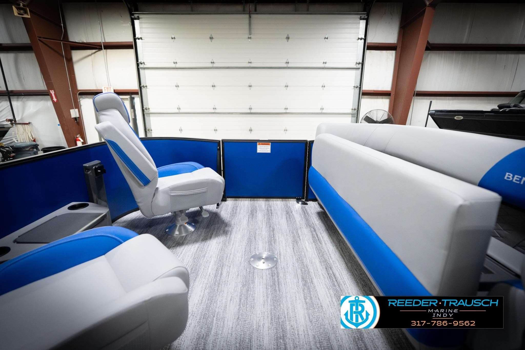 Interior of 2026 Bennington 22 SSB pontoon boat with blue and gray seating.