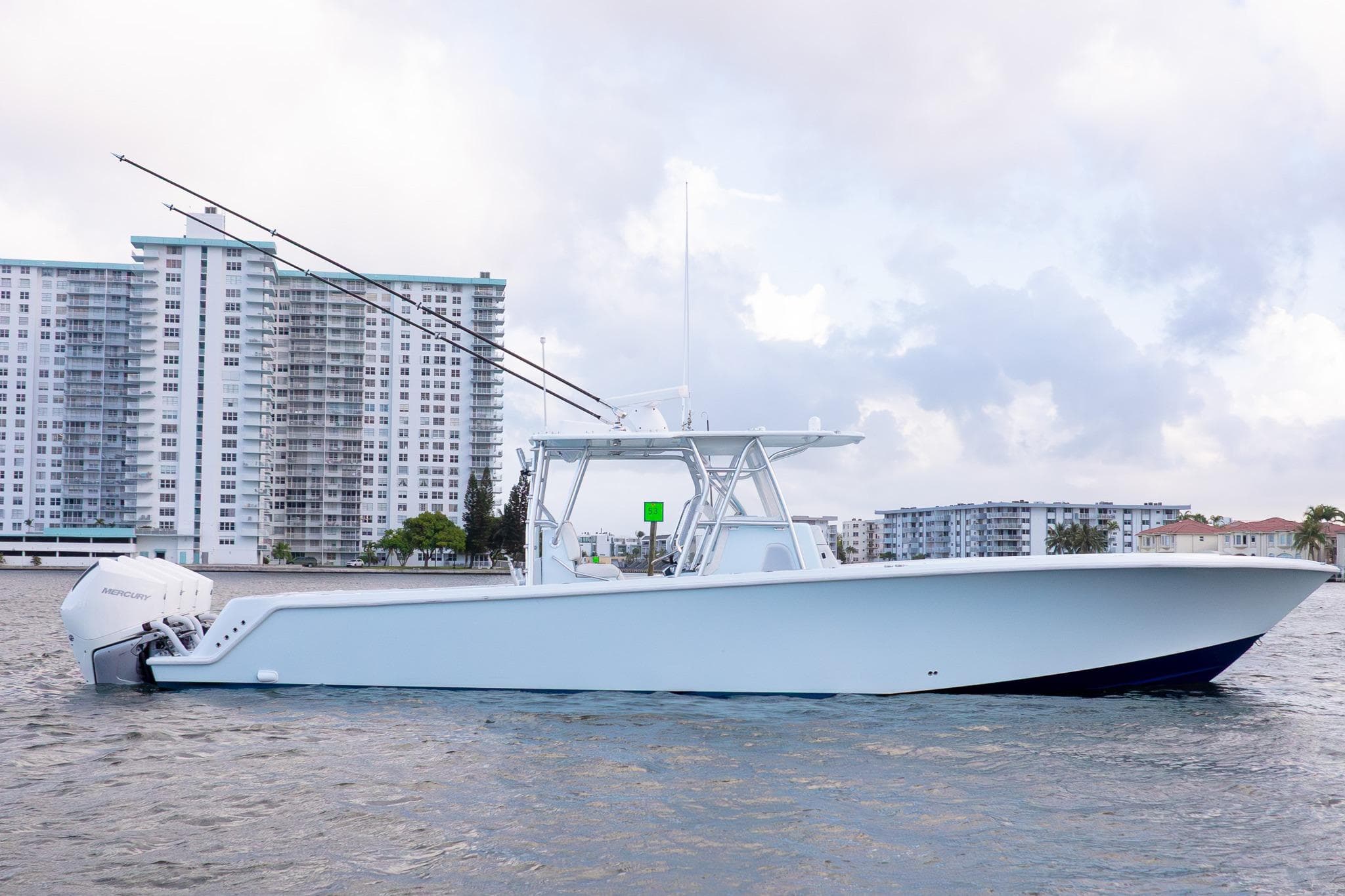 2023 SeaVee 390Z boat on water with cityscape background.