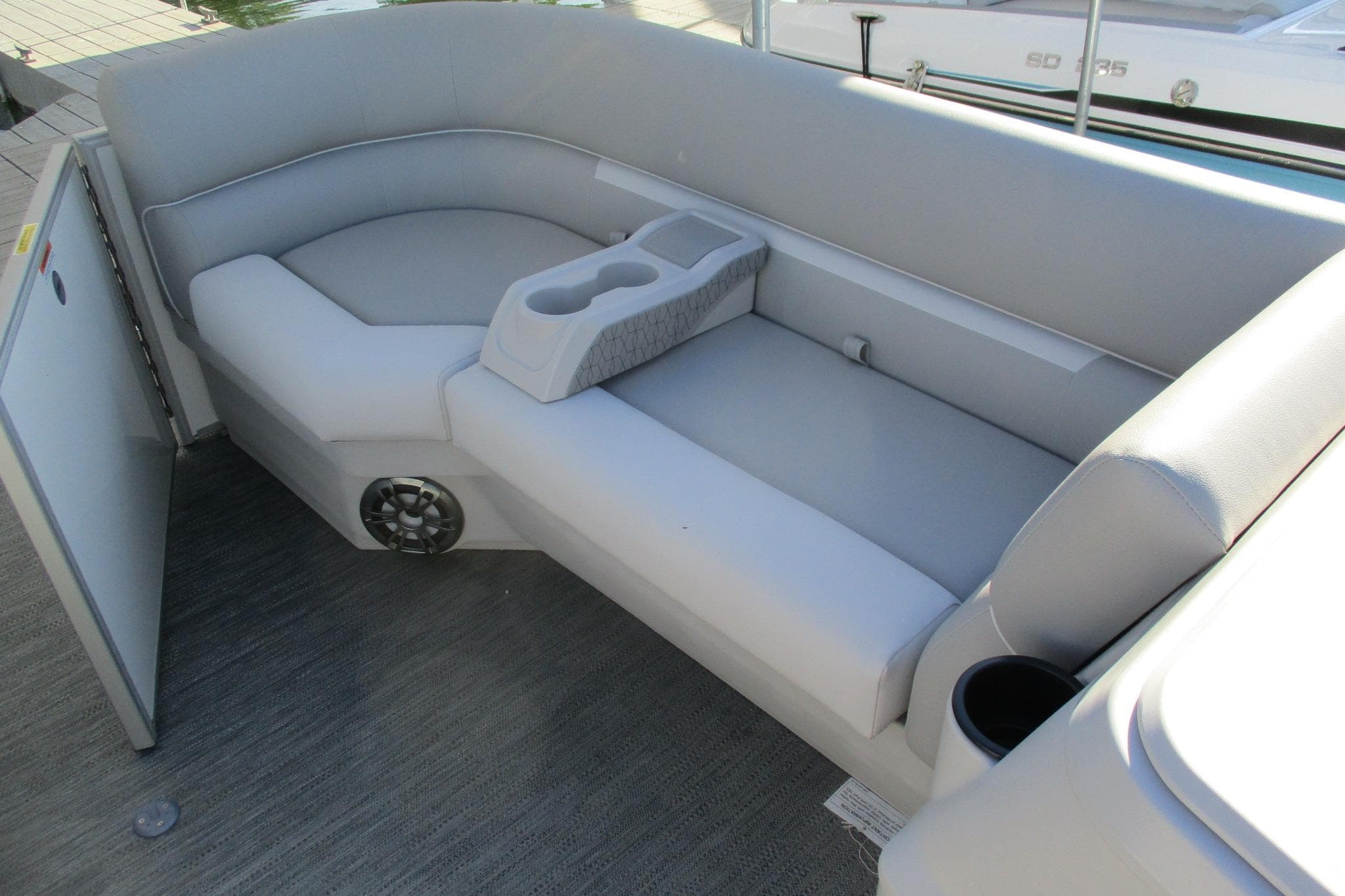 2024 Godfrey Sweetwater 2286 SBX boat interior with gray seating and cup holders.