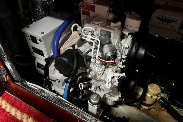 Engine compartment of a 1990 Bristol 47.7 Cutter/Sloop, showcasing mechanical components.