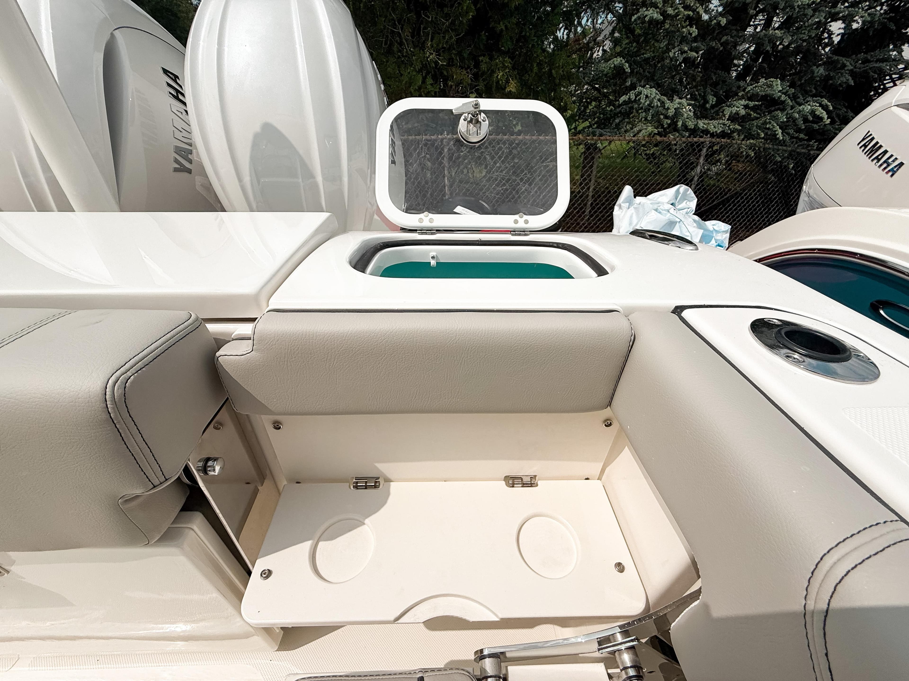 2025 Pursuit DC 266 Dual Console boat interior with storage and seating area.