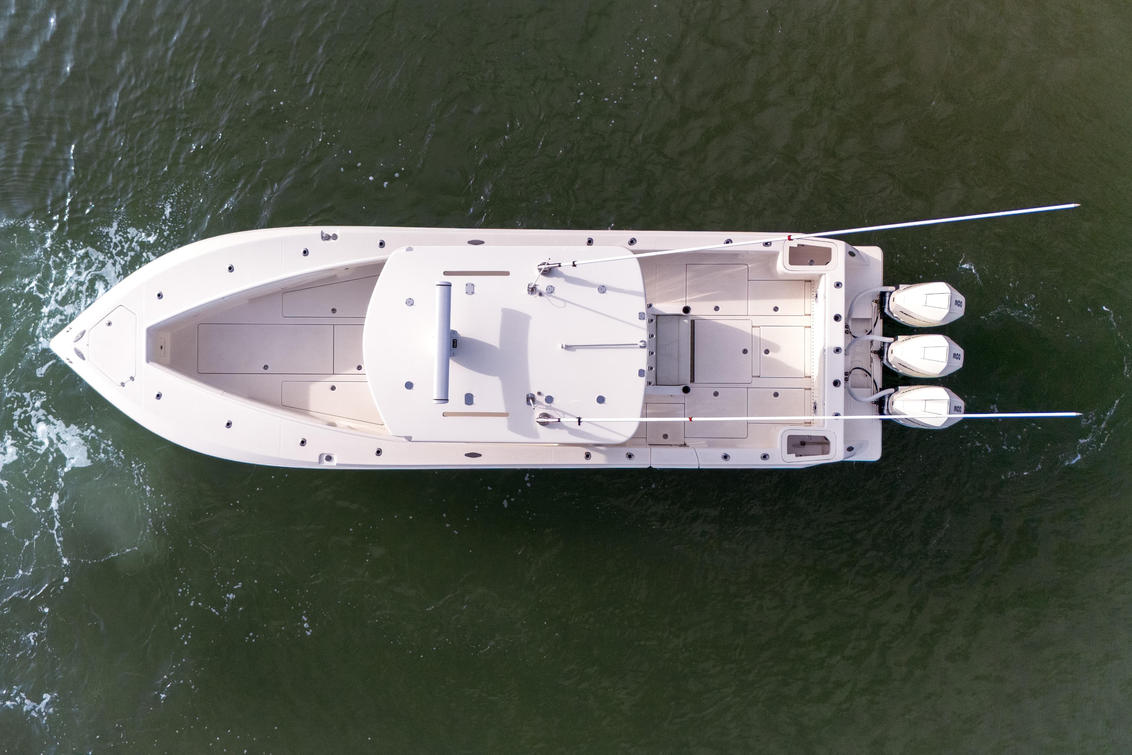 Top view of 2022 SeaVee 370Z boat with triple engines on water.