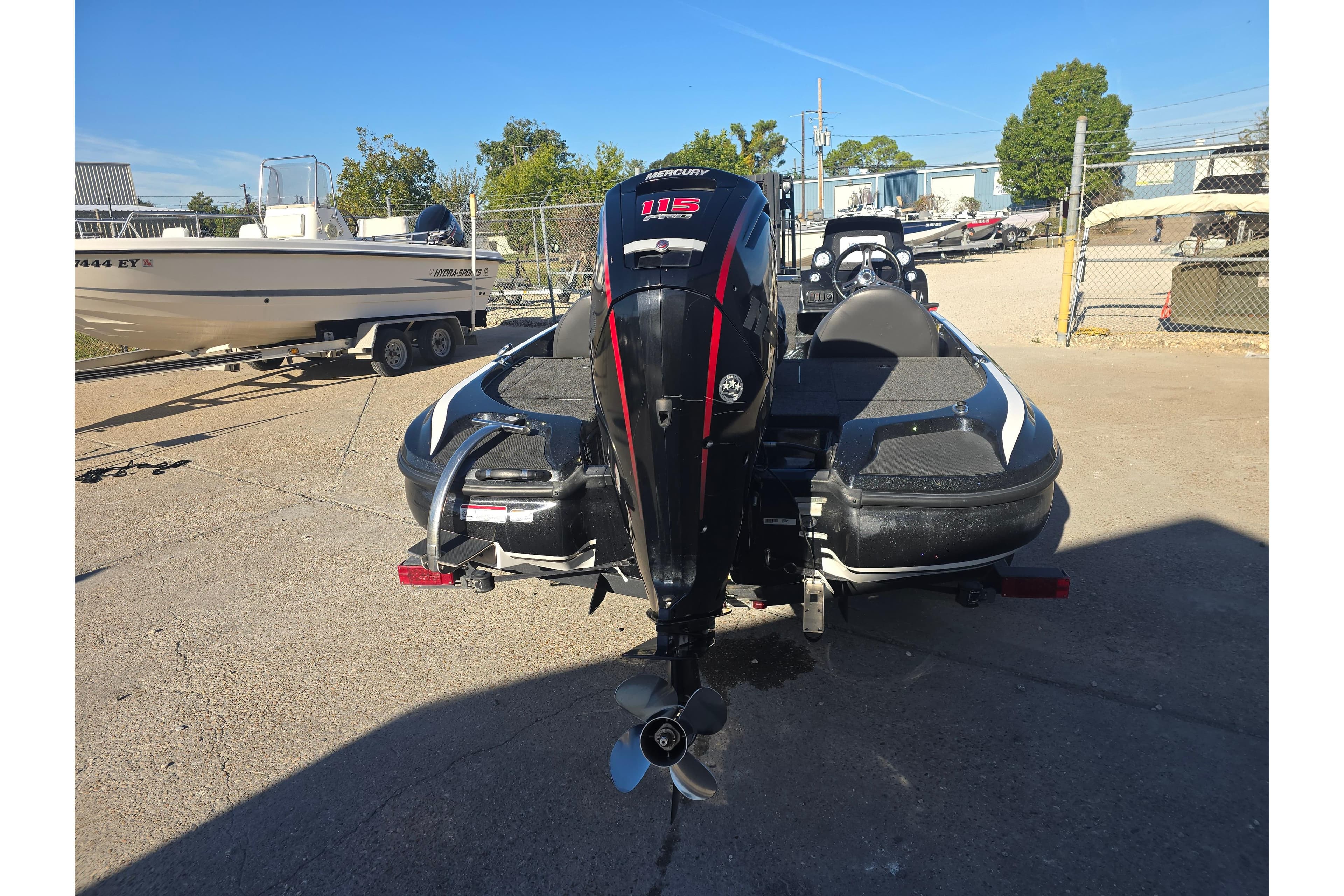 2018 Nitro Z17 boat with Mercury engine, parked on a trailer in a lot.