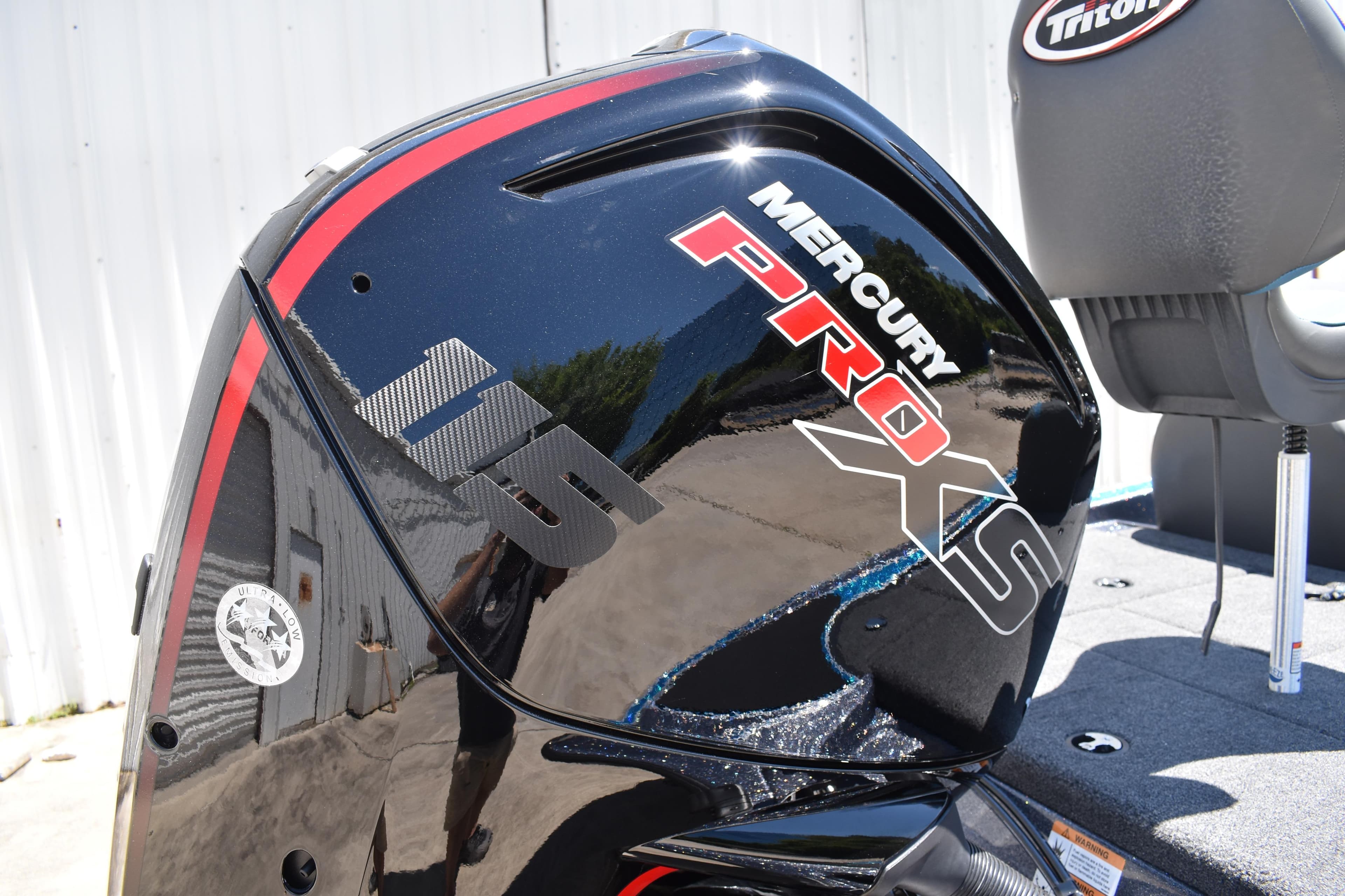 2026 Triton 179 TrX boat with Mercury Pro XS 115 engine, close-up view.