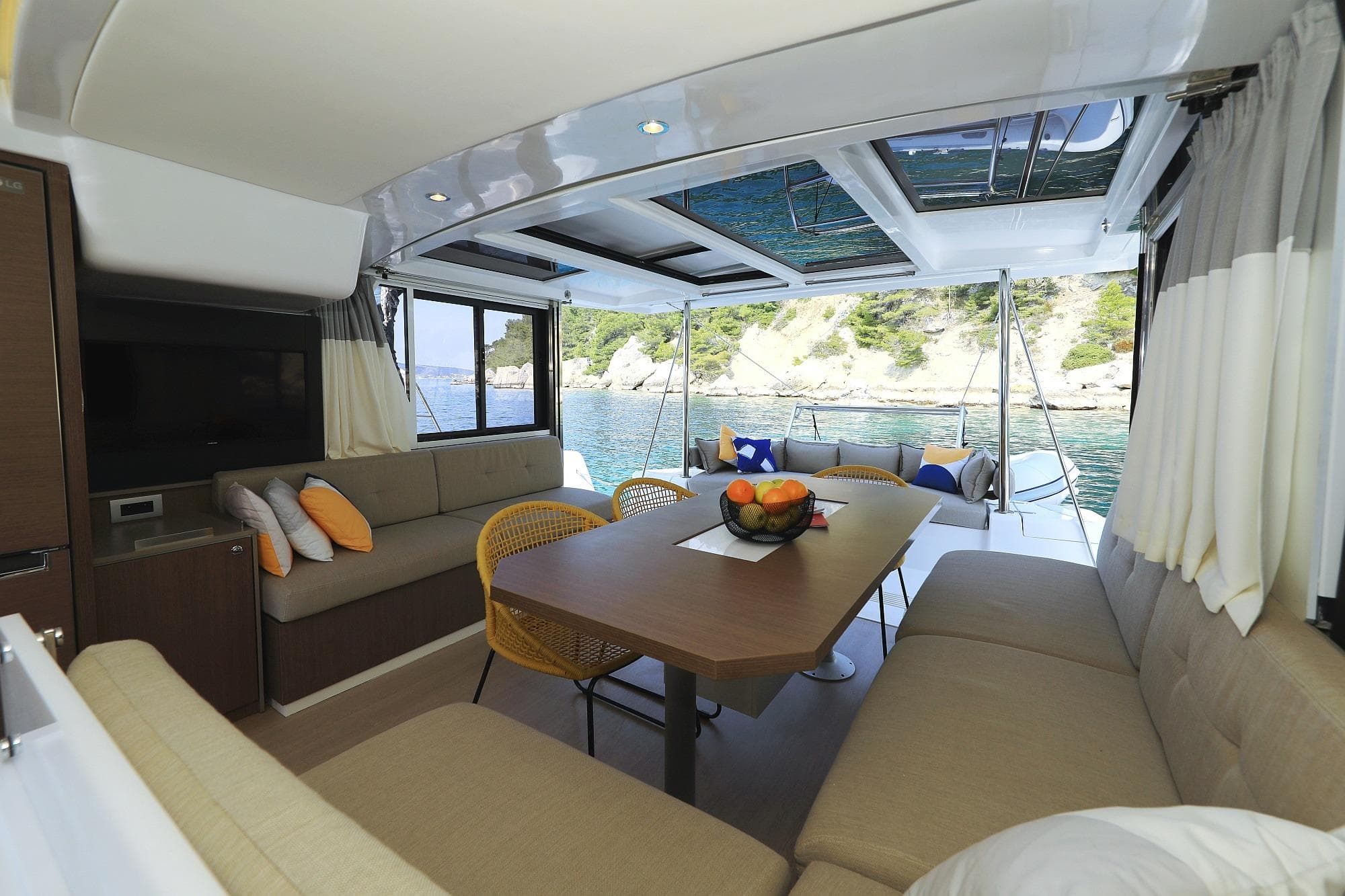Luxurious interior of 2021 Bali 4.2 catamaran with spacious seating and ocean view.