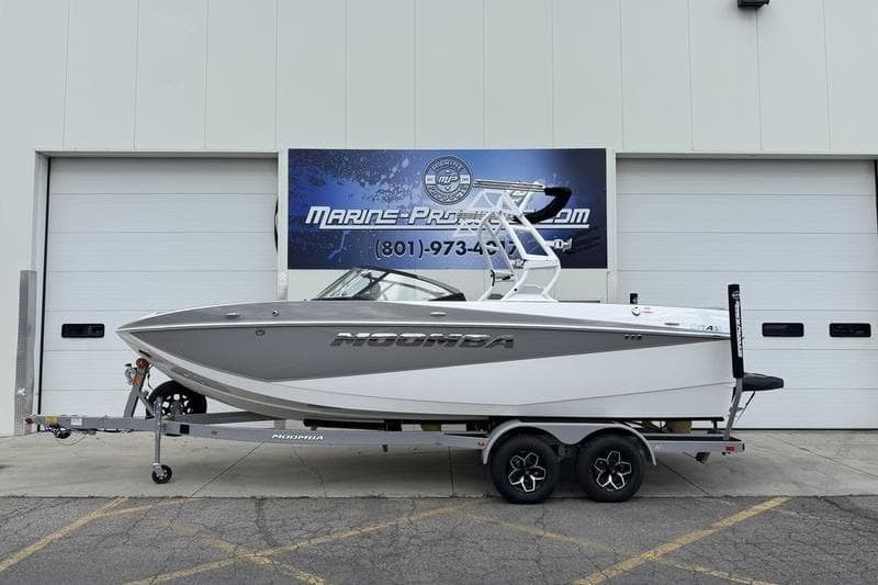 2025 Moomba Craz boat on trailer in front of Marine Products store.