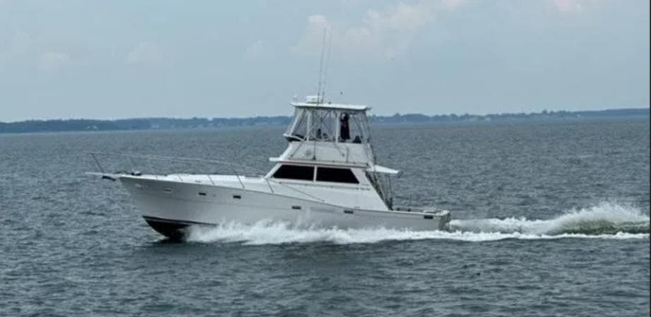 1973 Viking 40 yacht cruising on open water, showcasing sleek design and powerful performance.