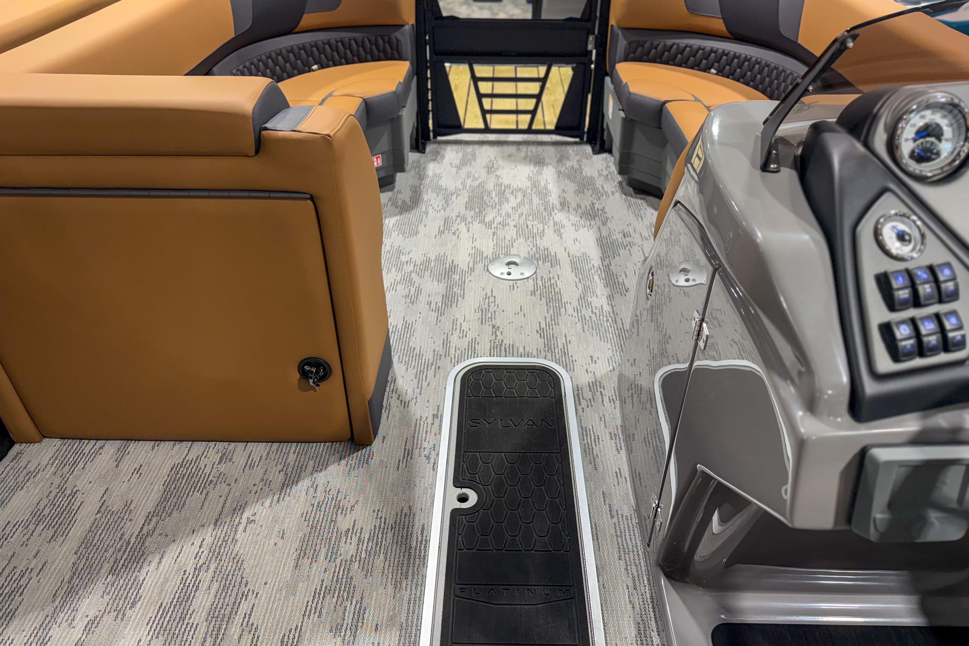 Interior of 2026 Sylvan L3 ULZ boat with tan seating and modern dashboard.