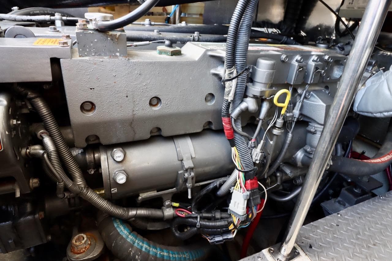 Engine compartment of a 2006 Regal Commodore 4460 with visible wiring and components.