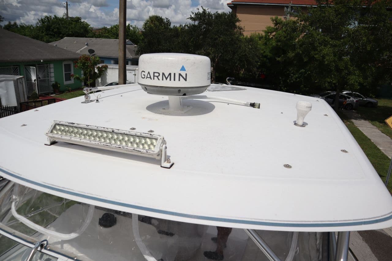 2007 Pro-Line 32 Express boat with Garmin radar on the roof.