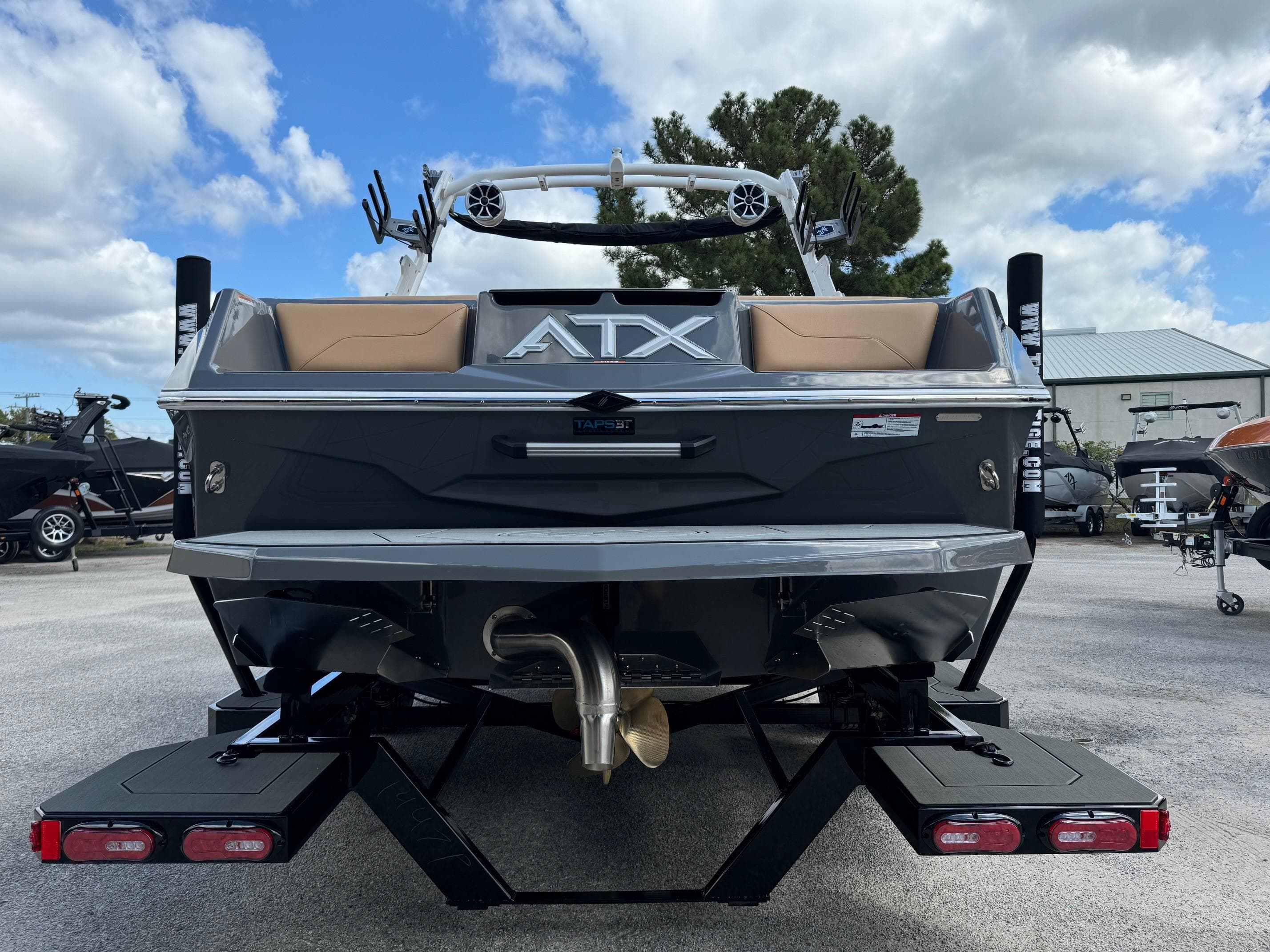 2025 ATX Surf Boats 22 Type-S, rear view, sleek design, outdoor setting.