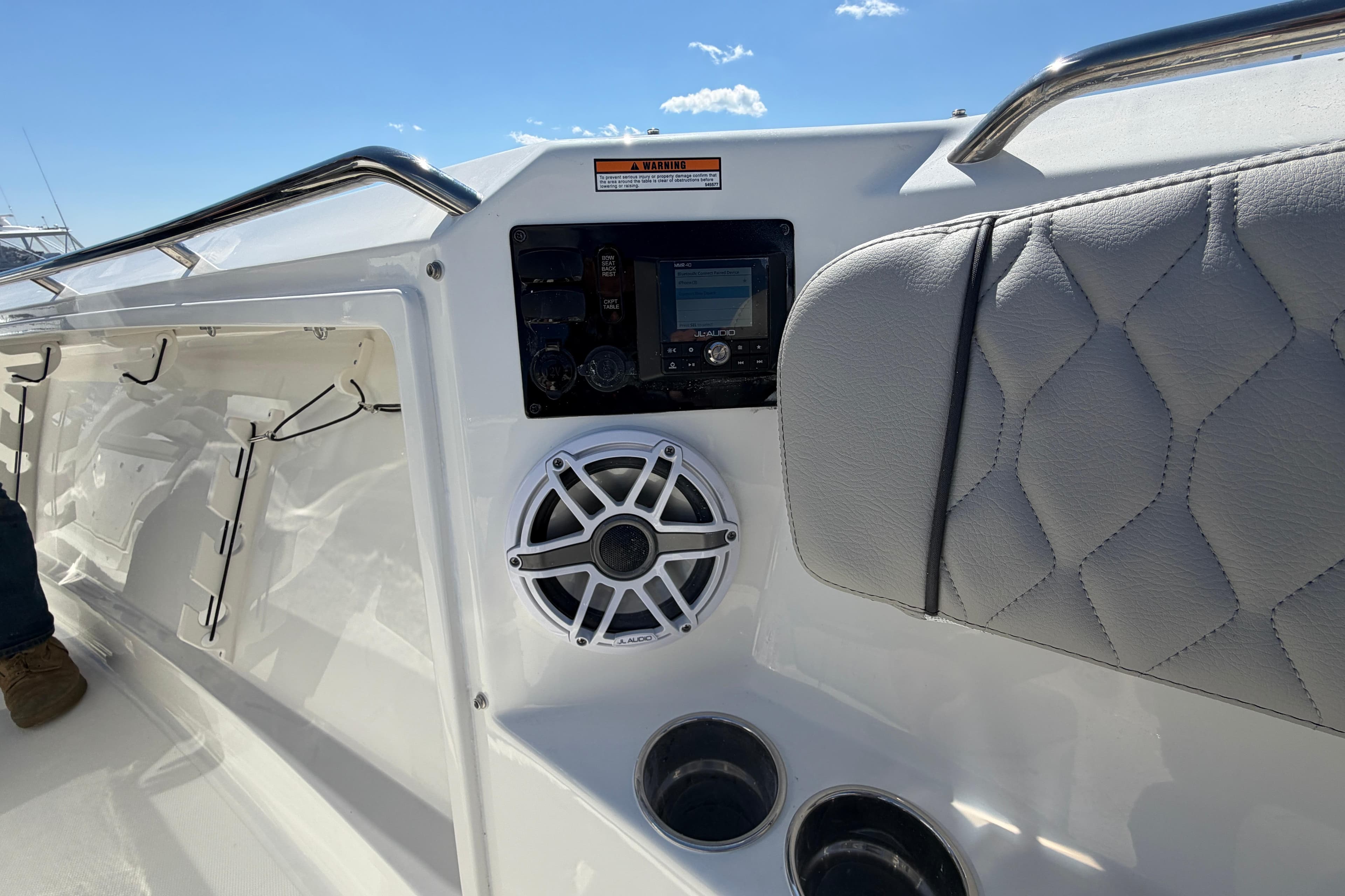 2026 Pursuit S 358 Sport boat interior with speaker and control panel.