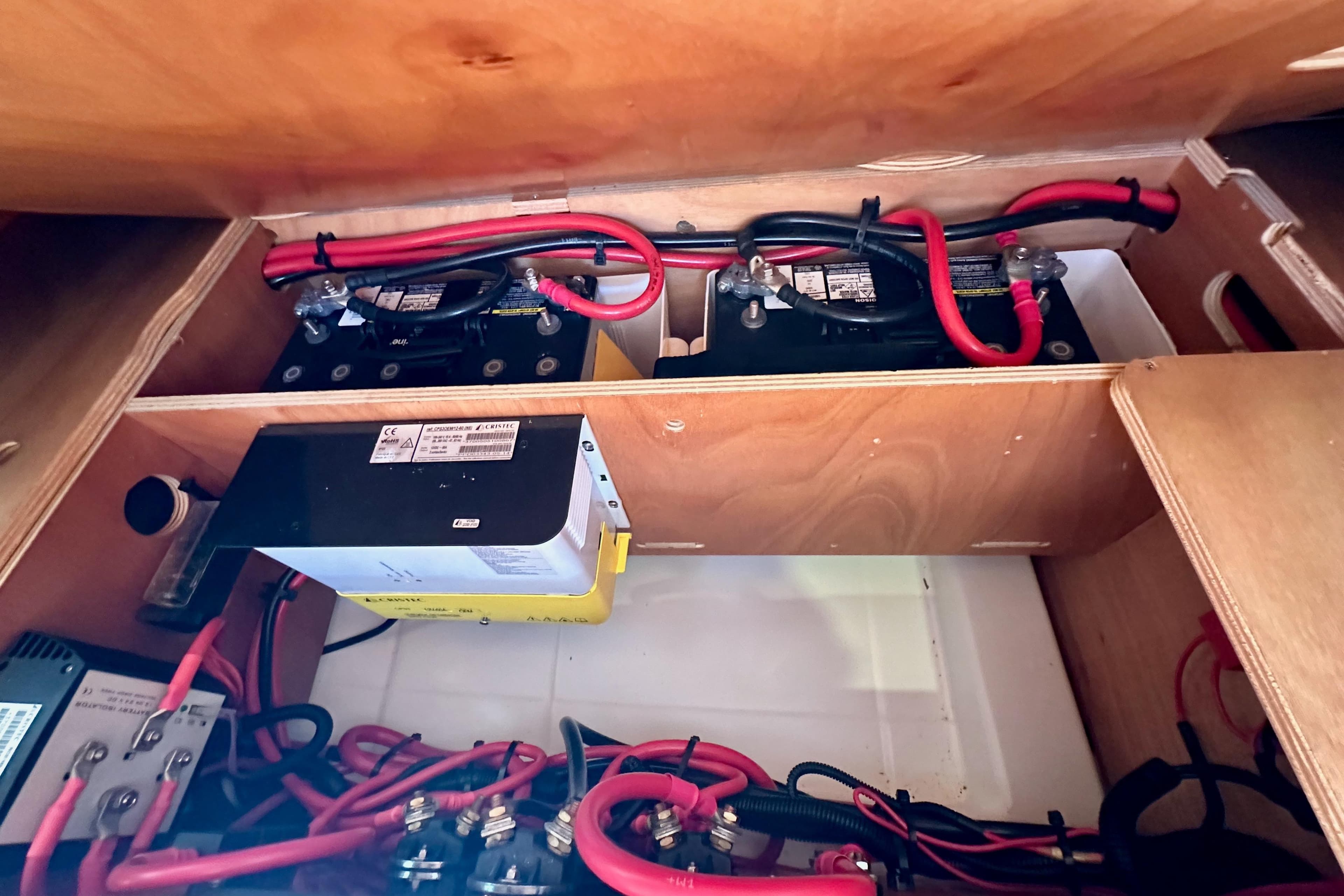 Battery compartment of 2015 Jeanneau Sun Odyssey 409 sailboat, featuring wiring and electrical components.