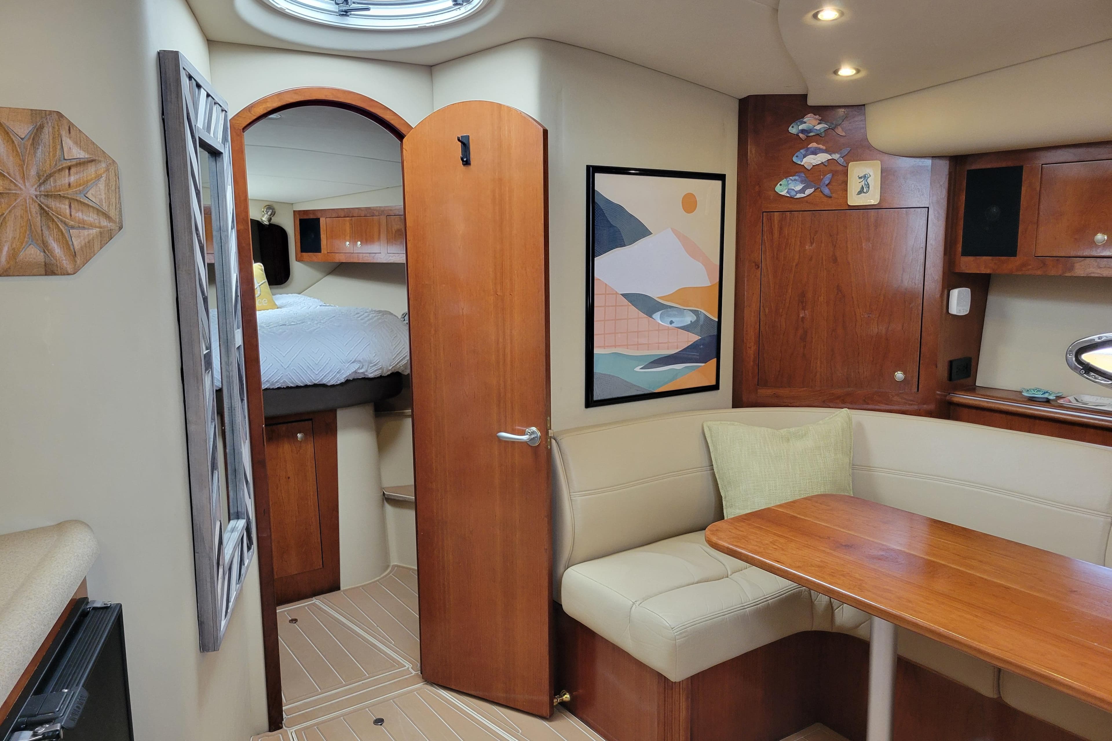 2004 Cruisers Yachts 400 Express interior with cozy seating and modern decor.