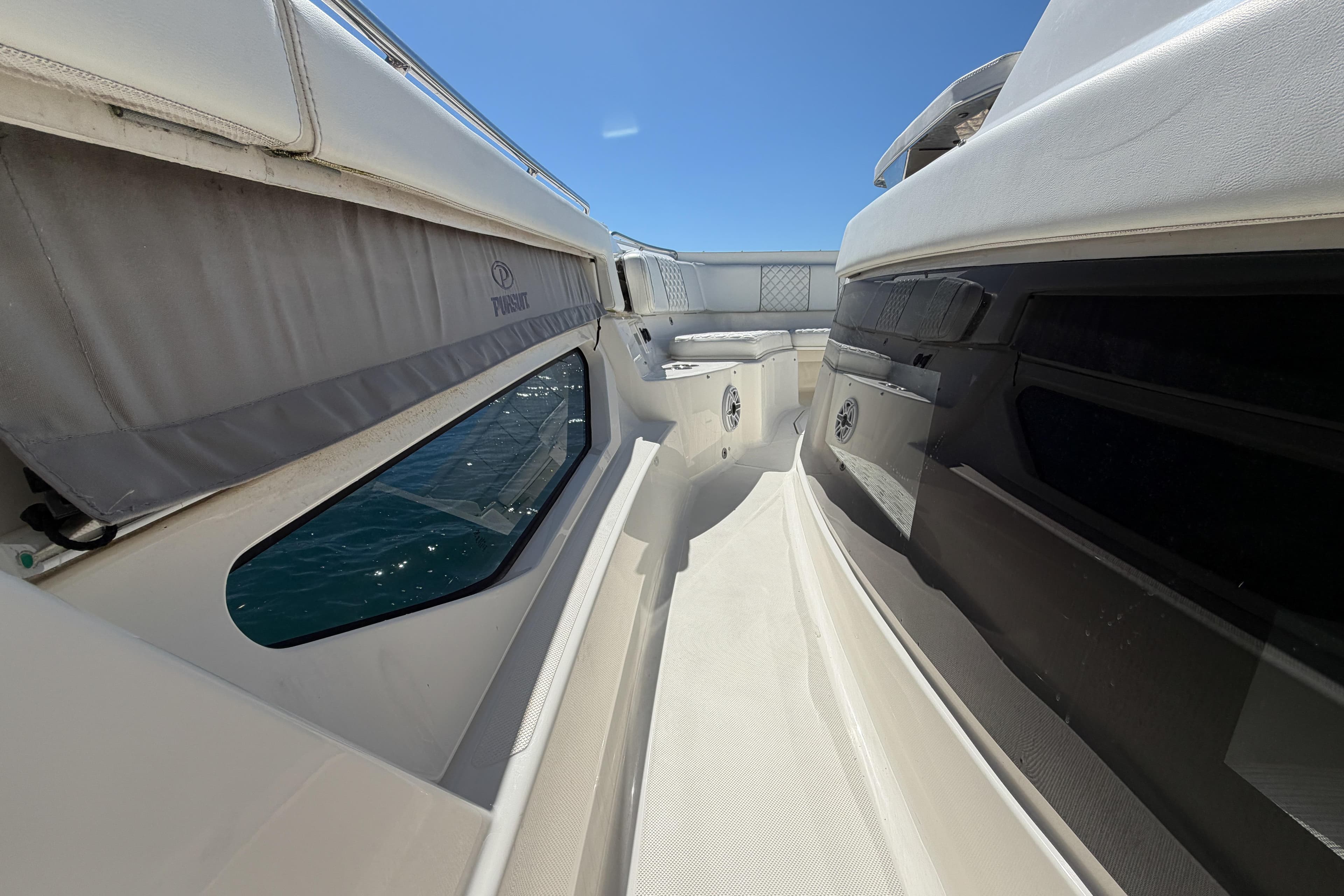 2021 Pursuit S 378 Sport boat deck with sleek design and ocean view.