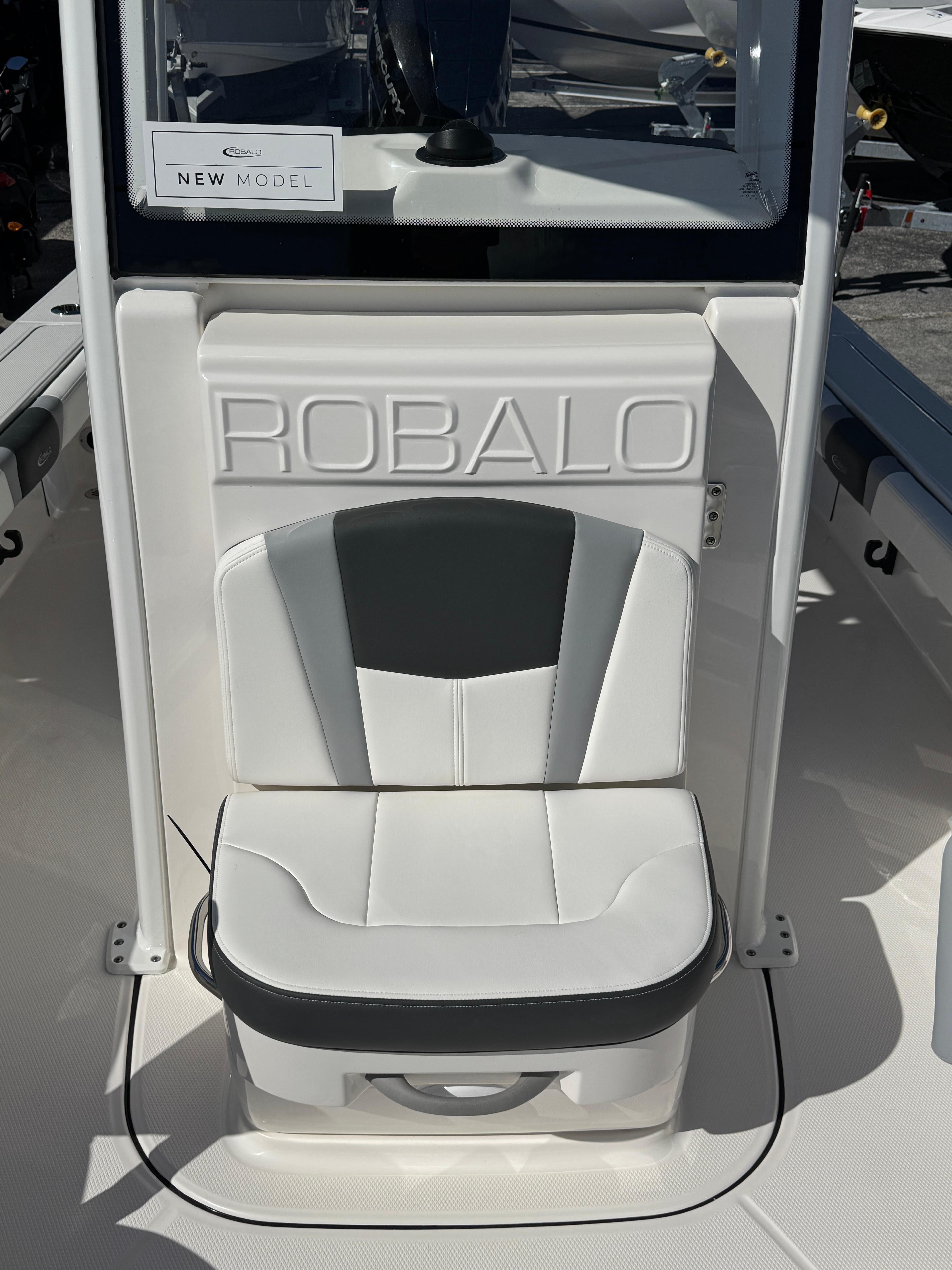 2024 Robalo 246 Cayman boat seat with logo, white and black design.
