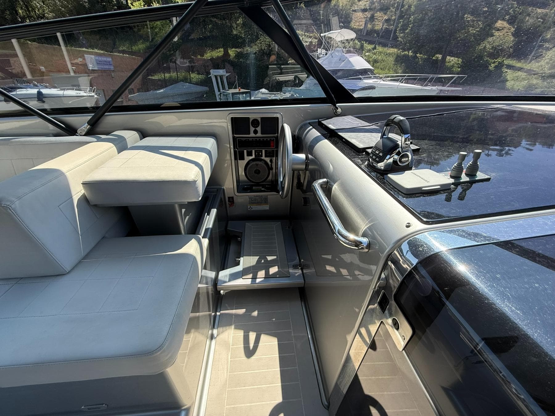 Interior of 2019 VanDutch 55 yacht with modern seating and control panel.