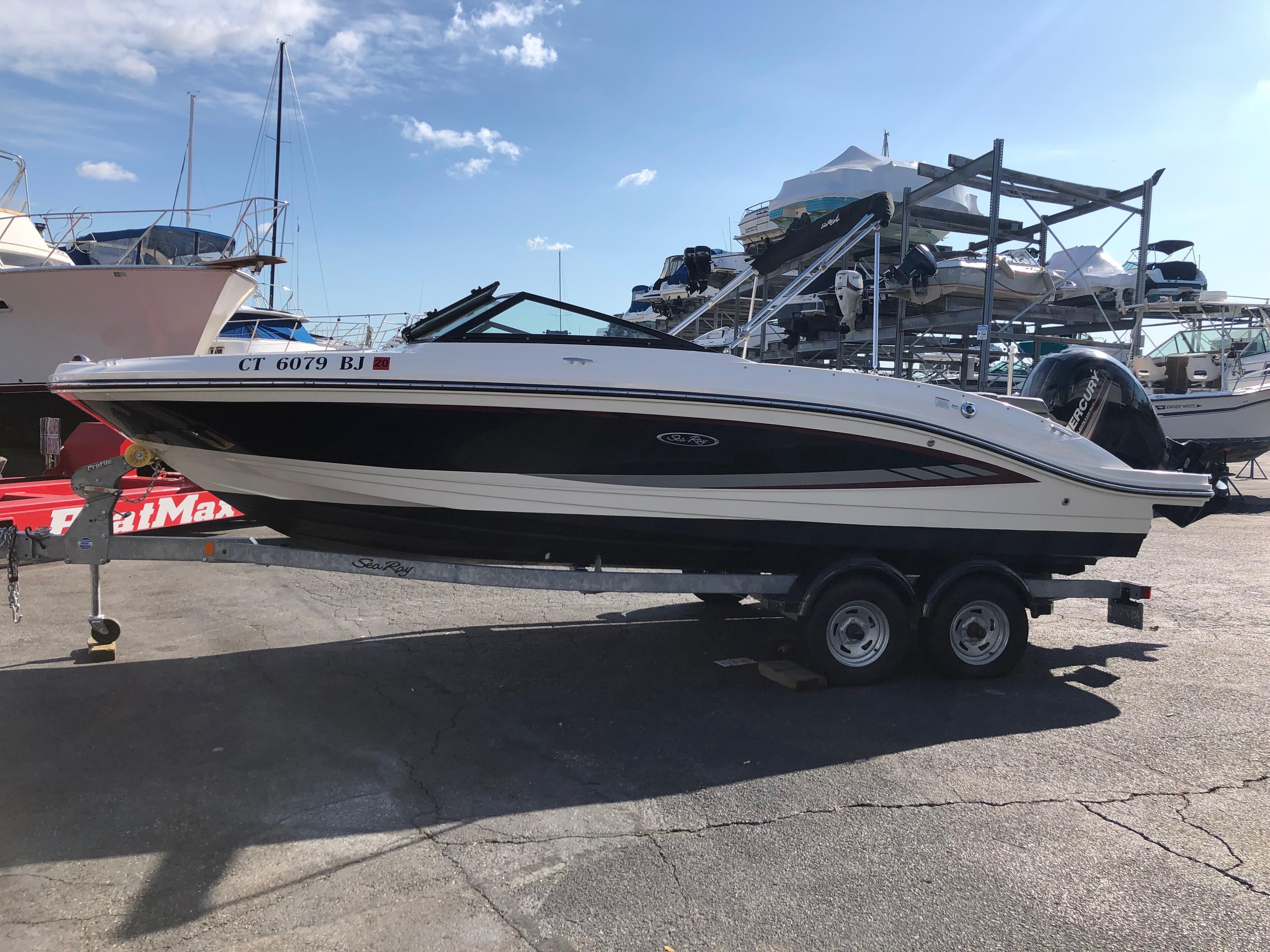 2017 Sea Ray 21 SPX boat on trailer at marina.