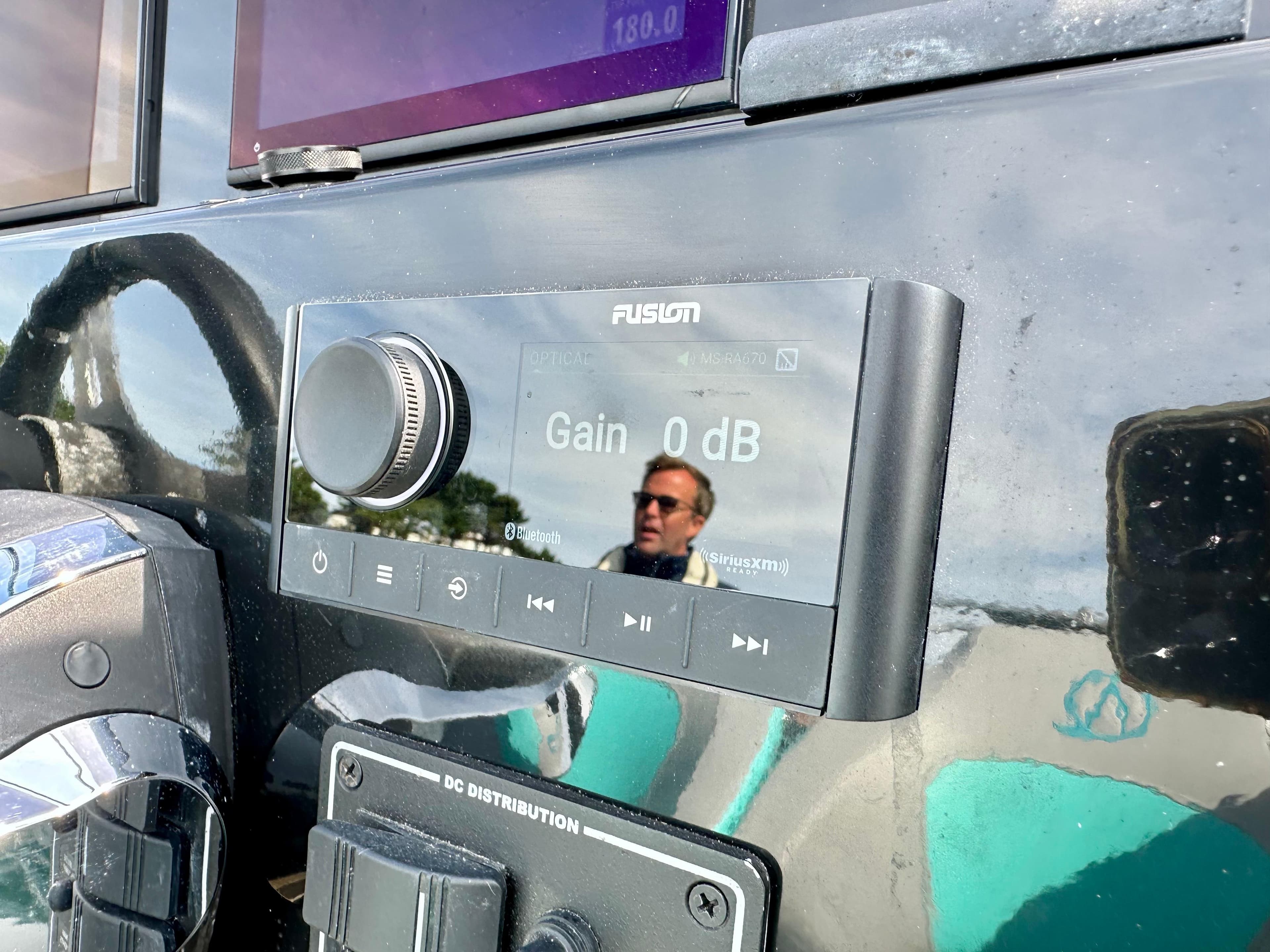 Fusion audio system on 2021 Ribquest Explorer boat dashboard, displaying gain settings.