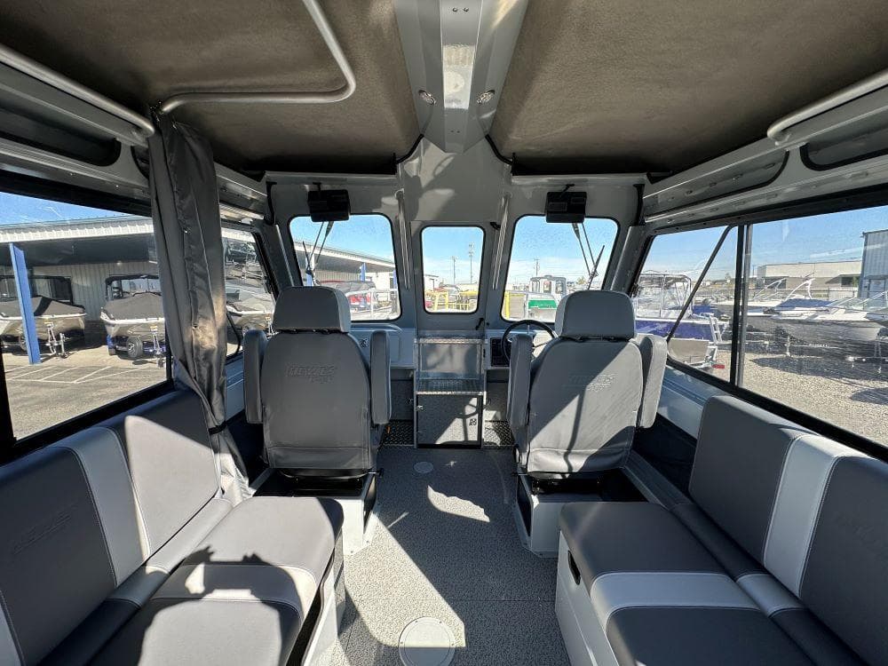 Interior of 2025 Hewescraft 220 Ocean Pro ET HT boat, featuring spacious seating and modern design.