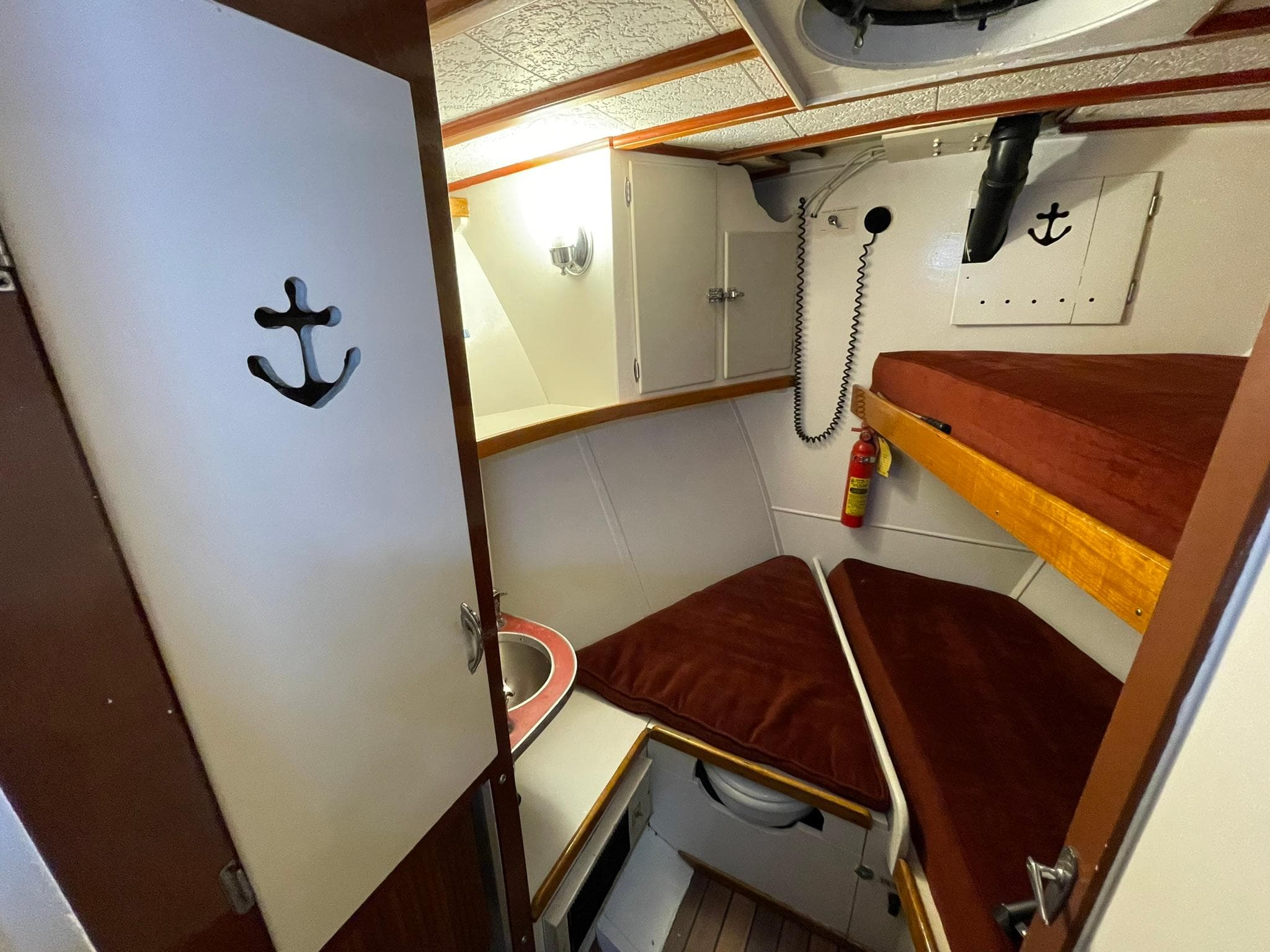 1951 Chris-Craft Catalina cabin interior with bunk beds and nautical decor.