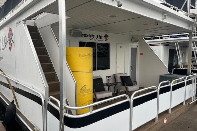 Houseboat with seating area, stairs, and "Giddy Up" sign, Fantasy model, 2008.