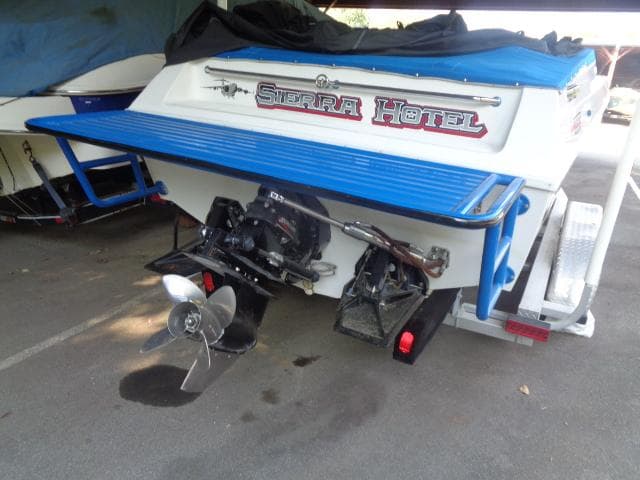 2001 Warlock 29 World Class boat with "Sierra Hotel" branding, parked on a trailer.