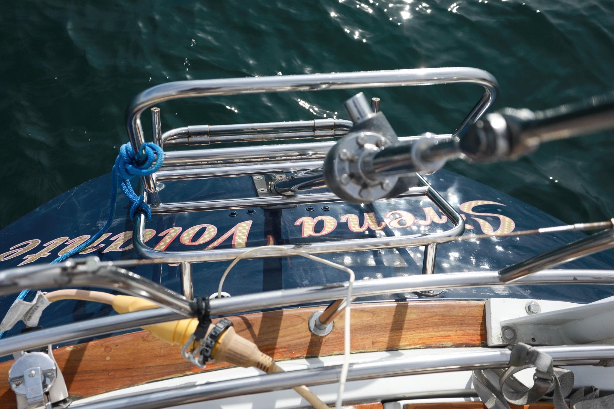 Stern view of 1988 Grand Soleil 46 Jezequel yacht with railing and water backdrop.