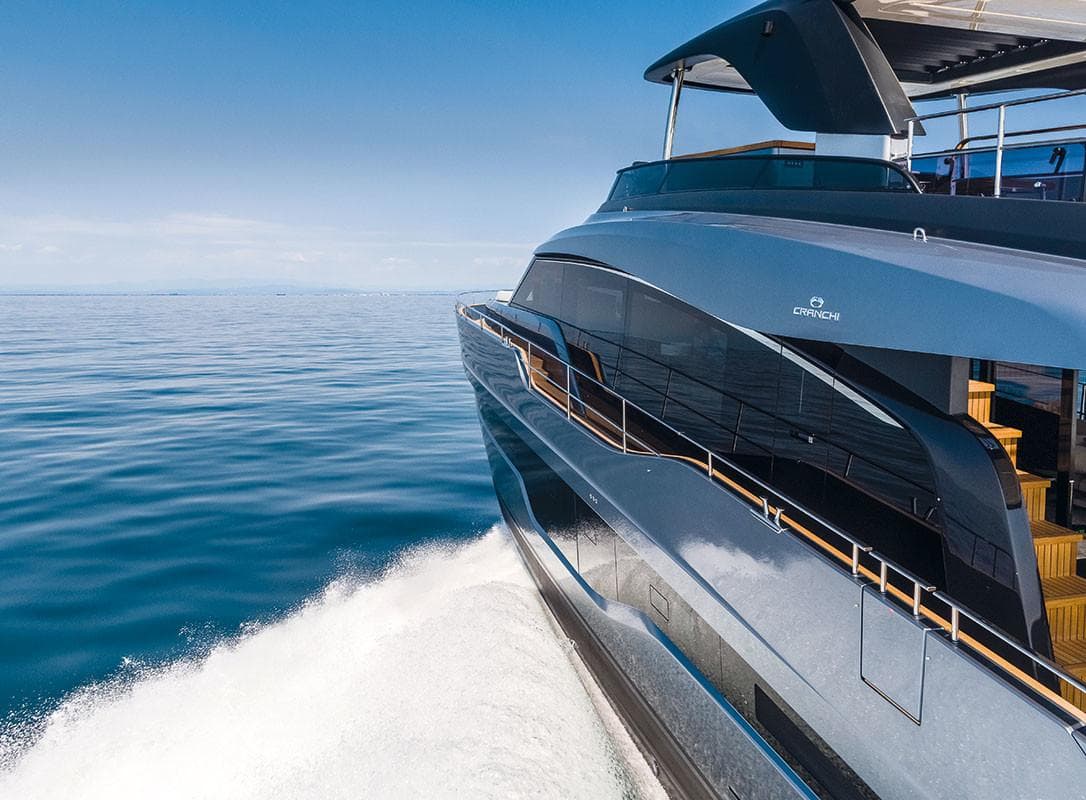 Luxury Cranchi Settantotto 78 yacht cruising on open sea, 2025 model.