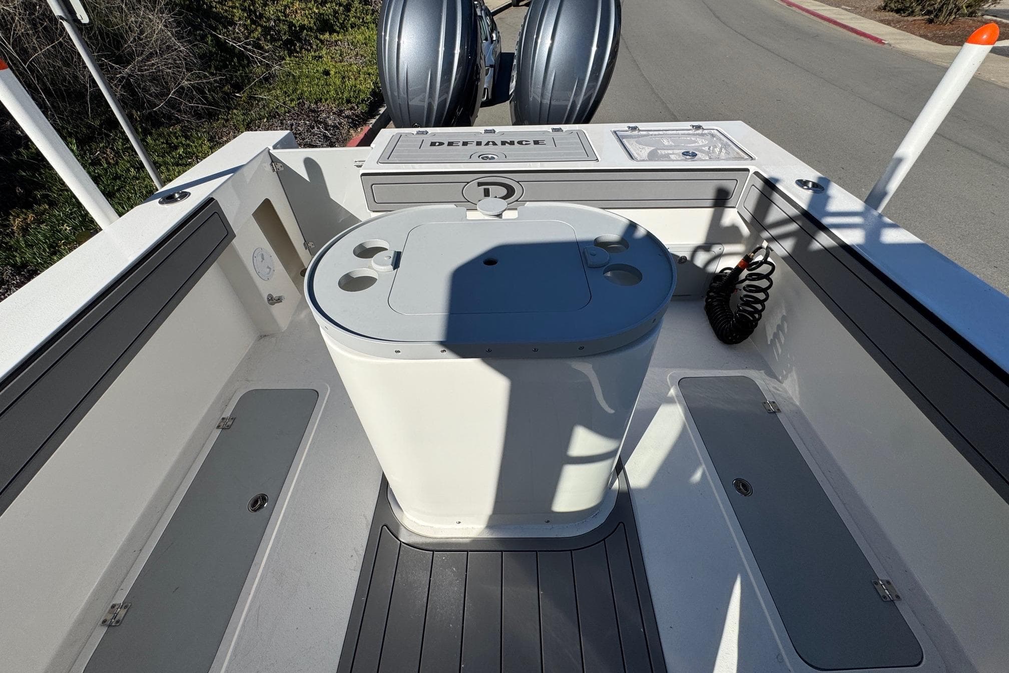 2026 Defiance Admiral 250 EX boat interior with storage compartments and seating.