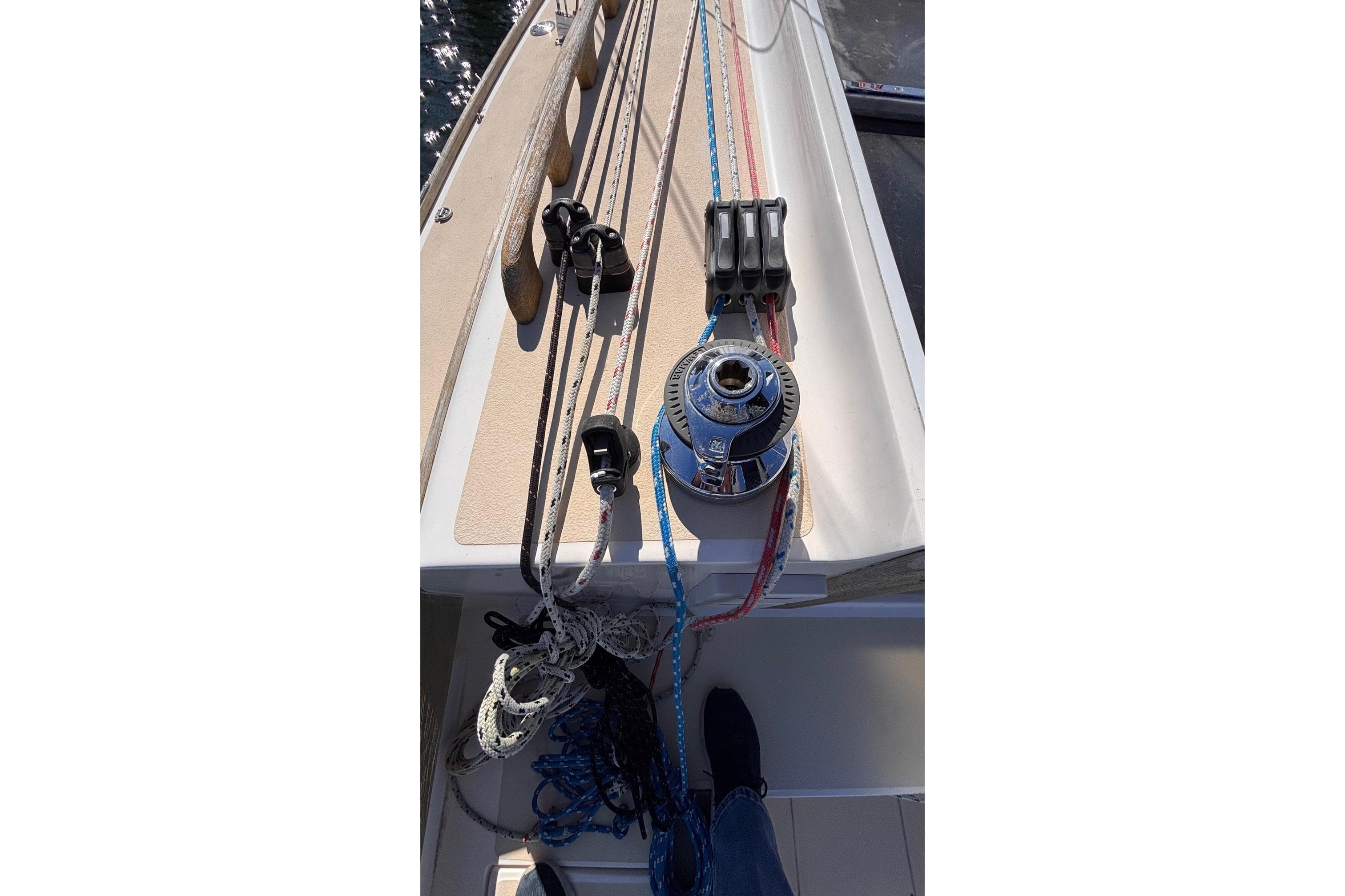 Deck view of 2016 Alerion Express 28 sailboat with winch and ropes.