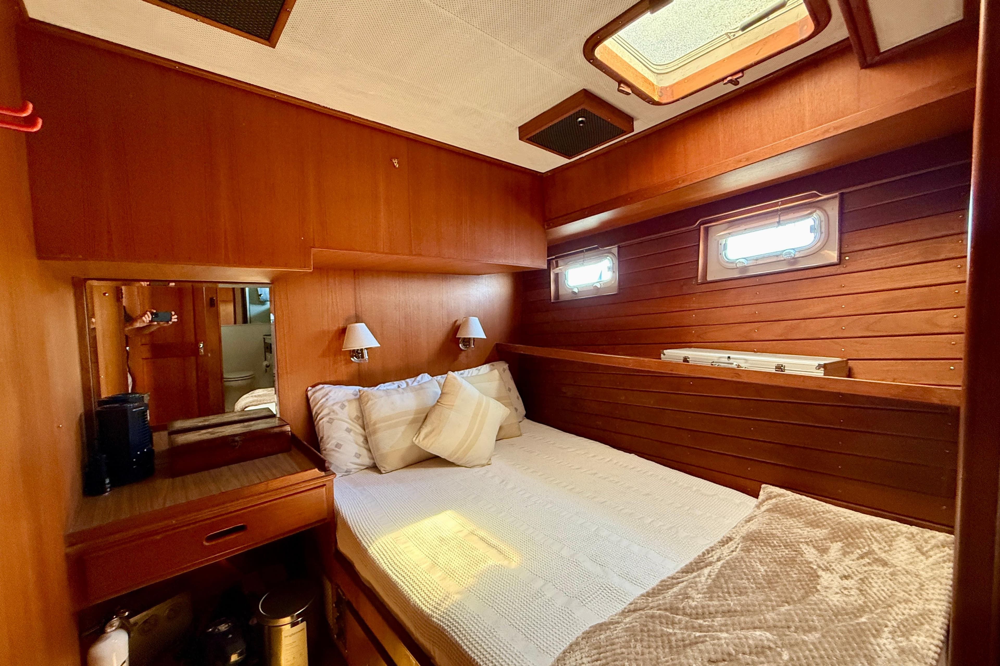Cozy 1991 Kong & Halvorsen Island Gypsy cabin with wood paneling and natural light.