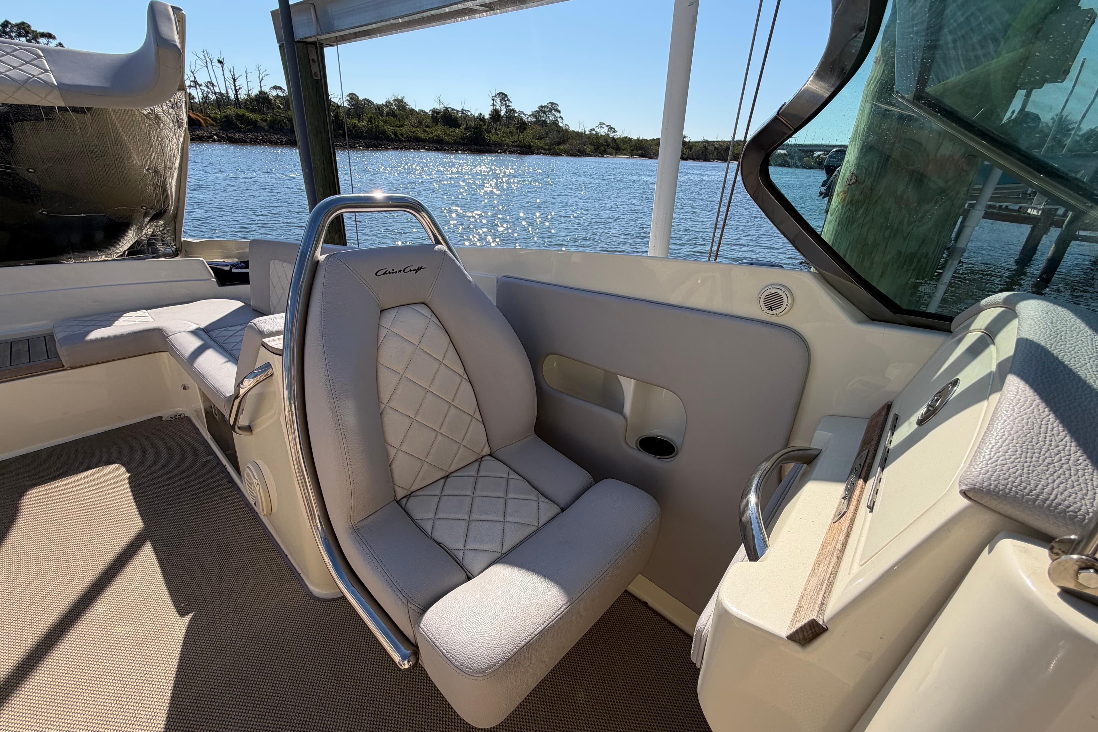 2019 Chris-Craft Launch 30 boat interior with luxurious seating and scenic water view.
