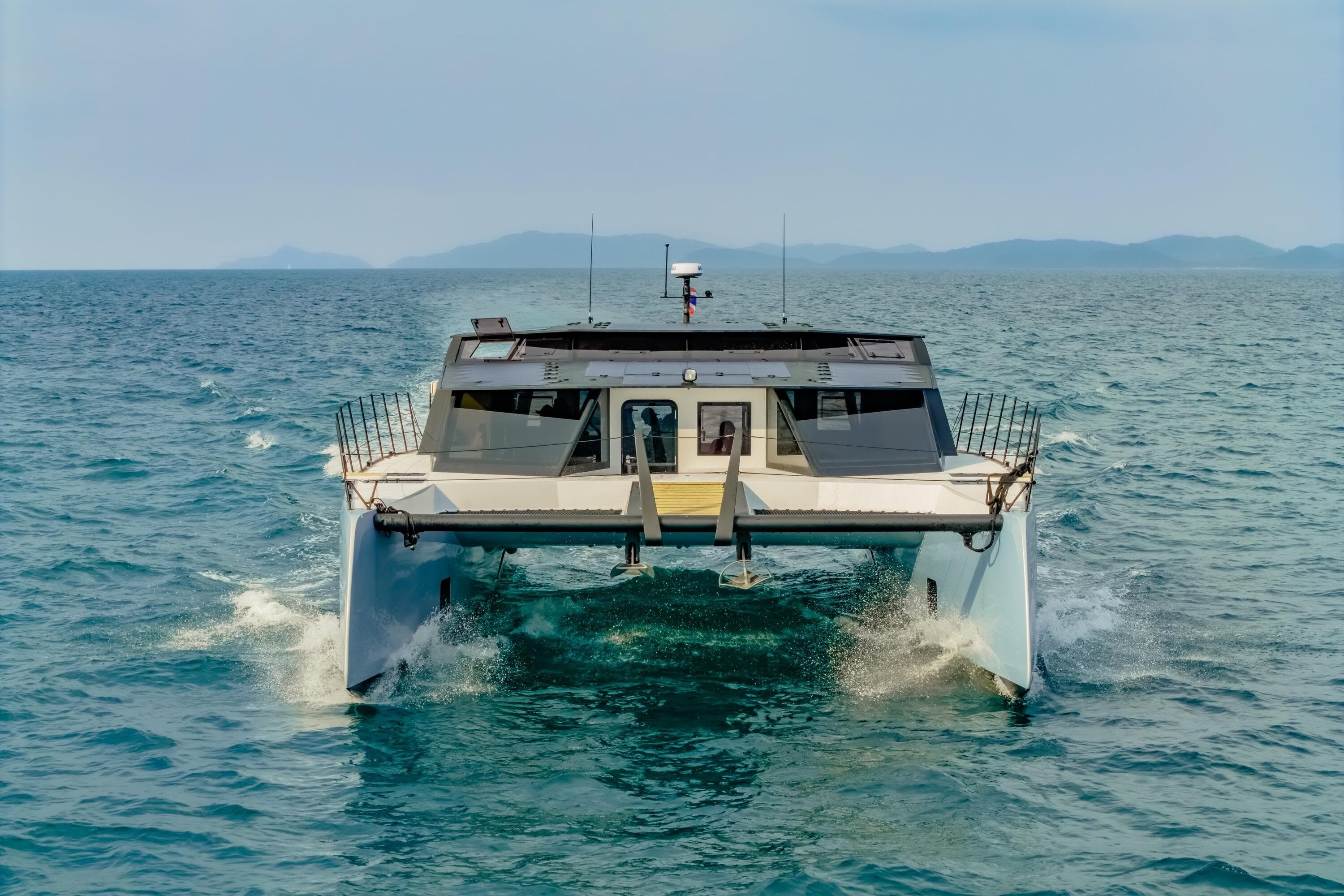 2025 Adventure Yachts AY60 Sport catamaran cruising on open sea.