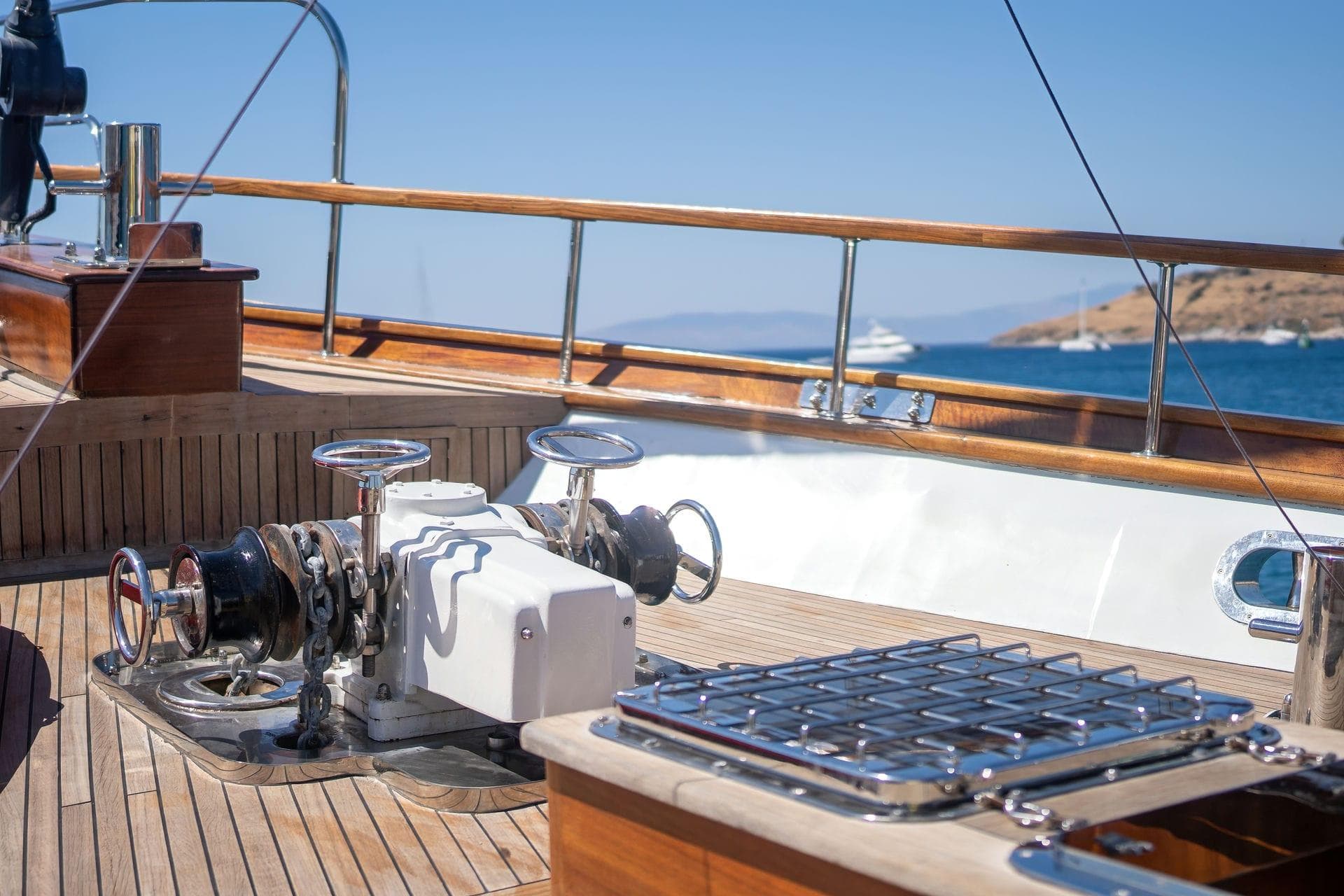 Luxurious yacht deck with winch system, Custom model 134, 2015, overlooking serene ocean view.