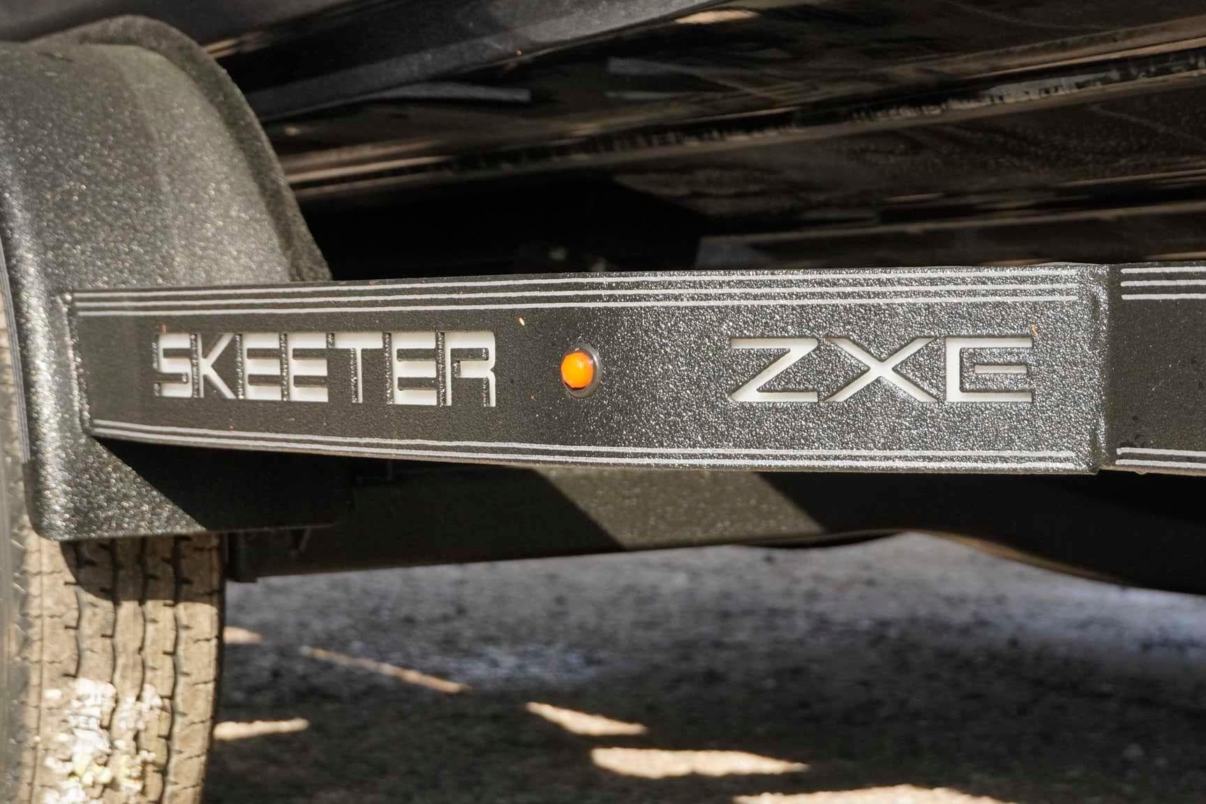 2026 Skeeter ZXE20 trailer detail with logo and orange reflector.