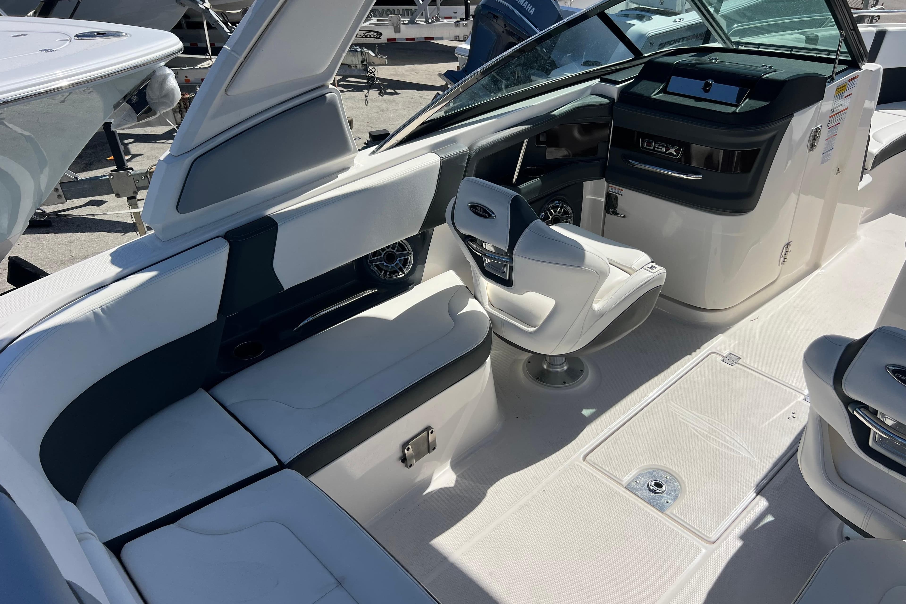 2023 Chaparral 270 OSX boat interior with seating and helm station.