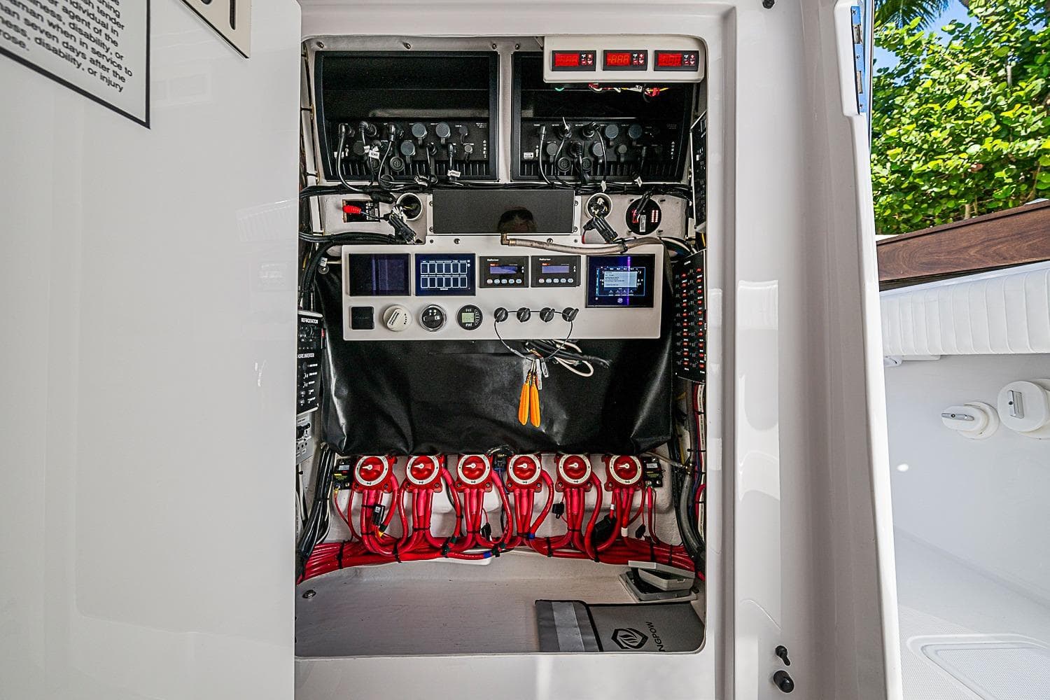 Electrical panel of a 2022 Bahama 41 boat, showcasing wiring and controls.