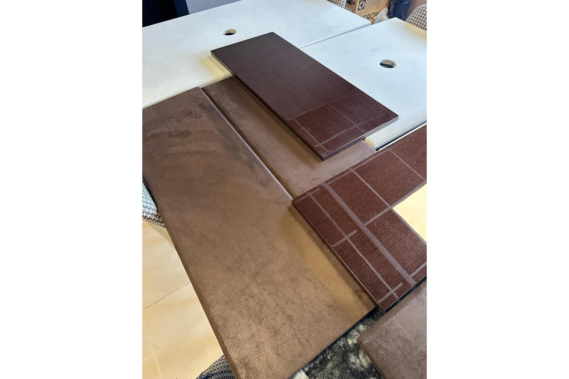 Interior design materials for Custom Motor Yacht 25 M, 2026 model, featuring brown and beige tones.