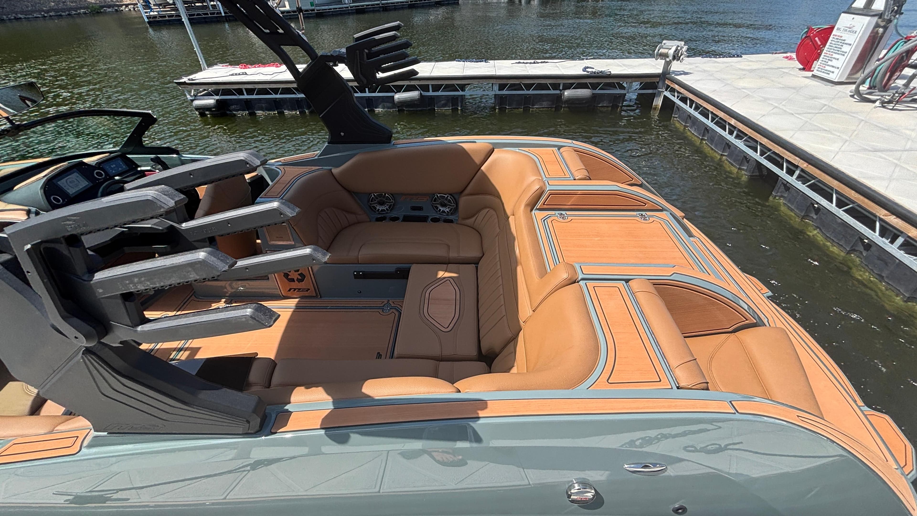 Luxurious interior of 2025 MB B52 25 Alpha boat with tan leather seating.