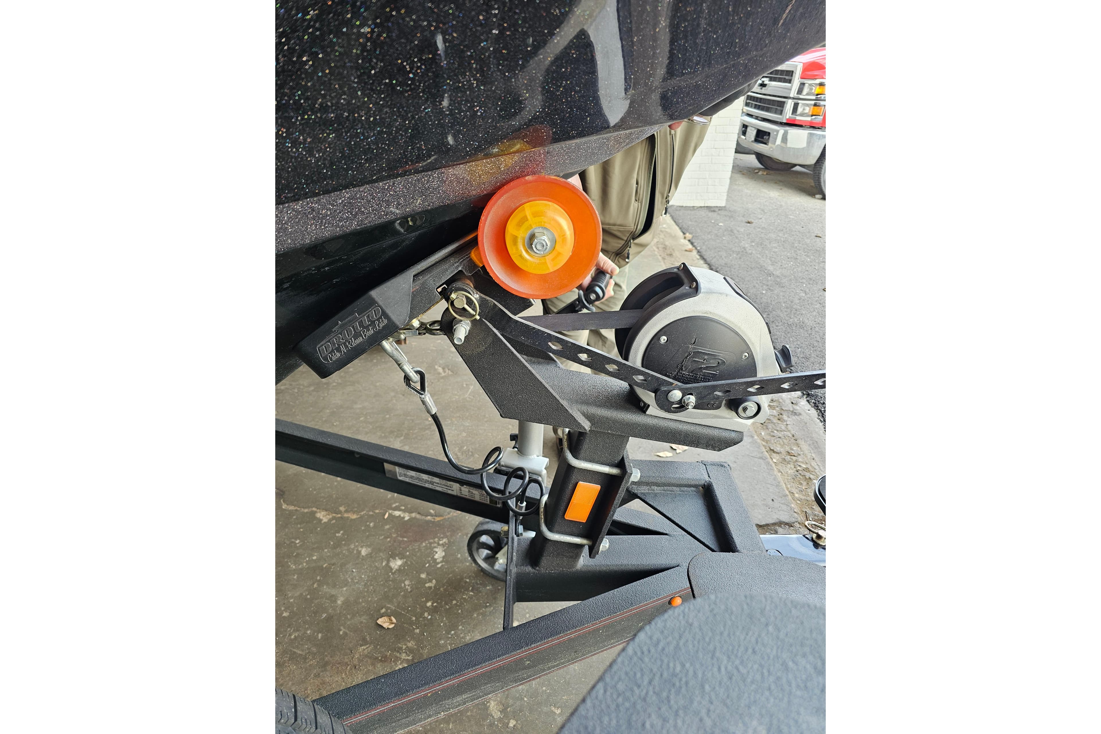 2023 Skeeter WX2200 boat trailer hitch with orange roller and winch.
