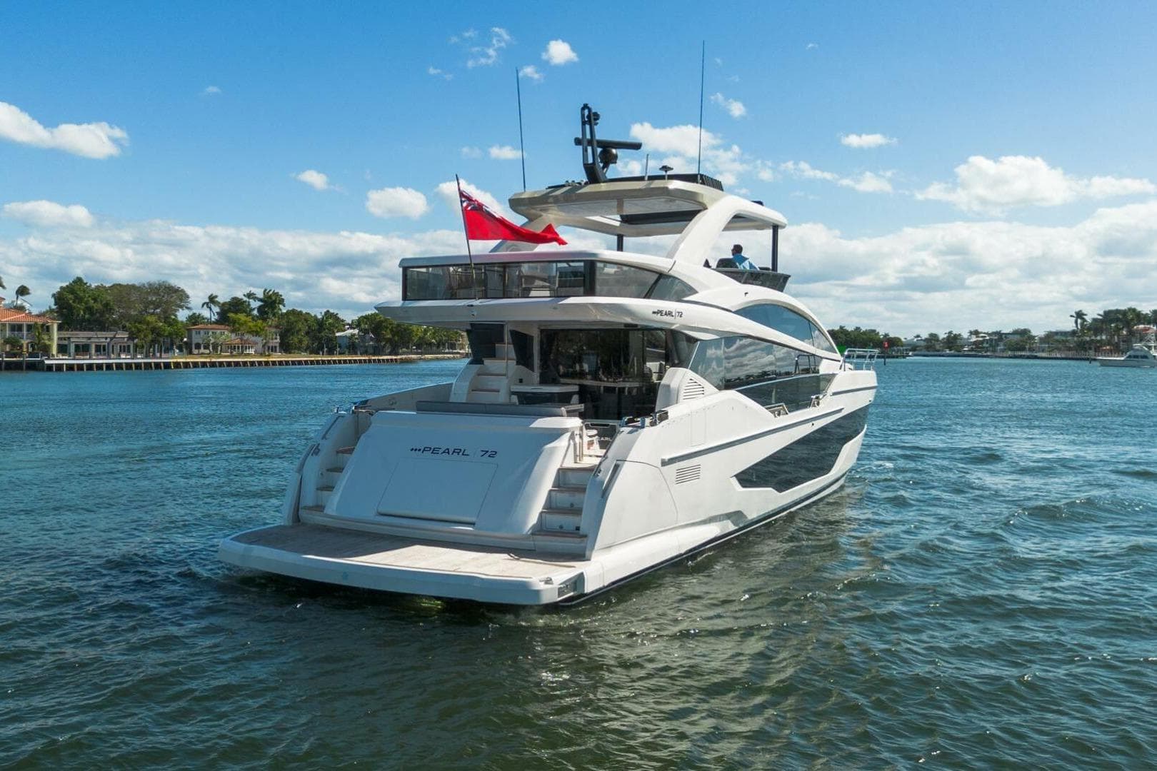 Luxury Pearl 72 yacht cruising on a sunny day, 2023 model.
