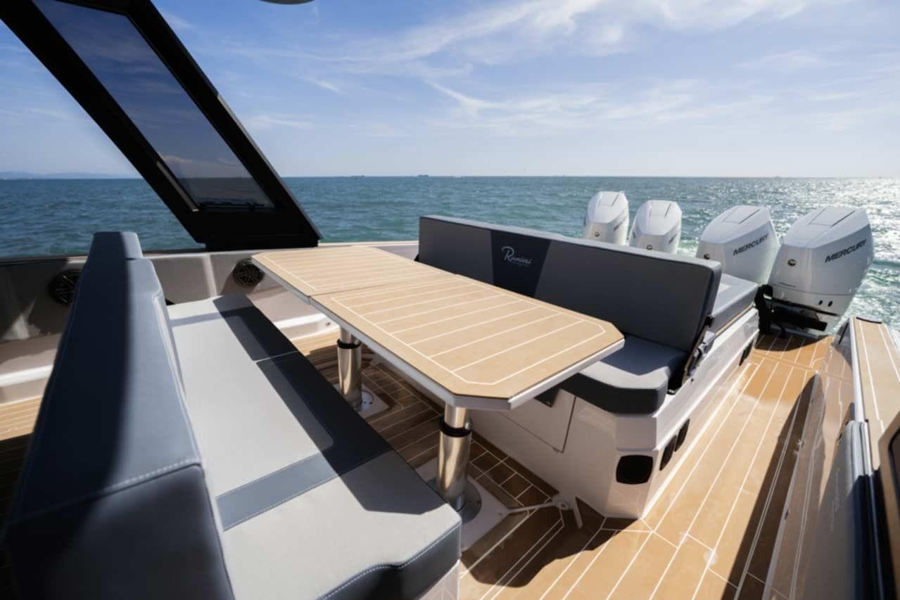 Luxurious 2026 Ranieri CAYMAN 50 HARDTOP yacht with elegant seating and ocean view.