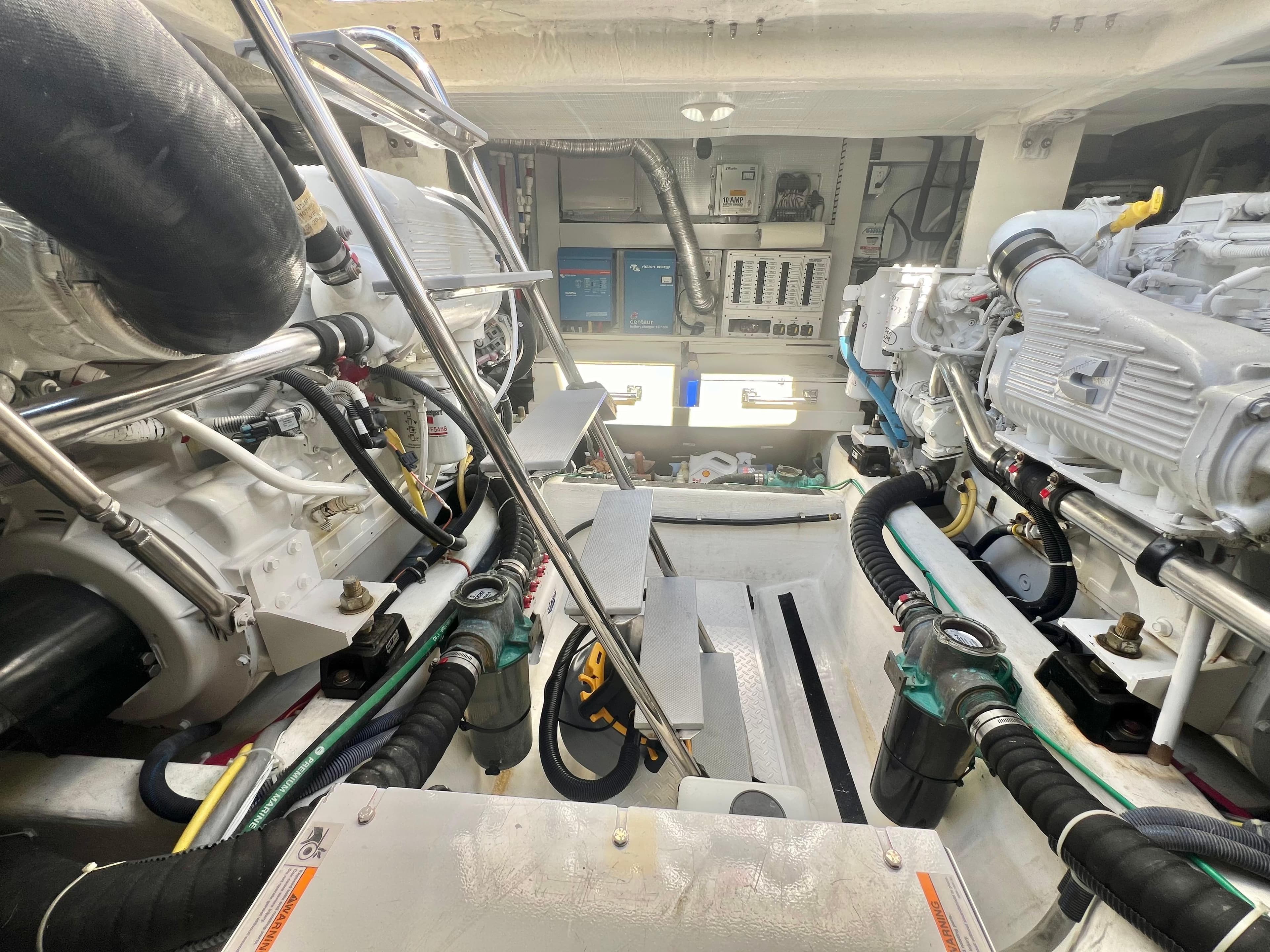 Engine room of 2017 Sabre 48 Salon Express, showcasing dual engines and mechanical components.