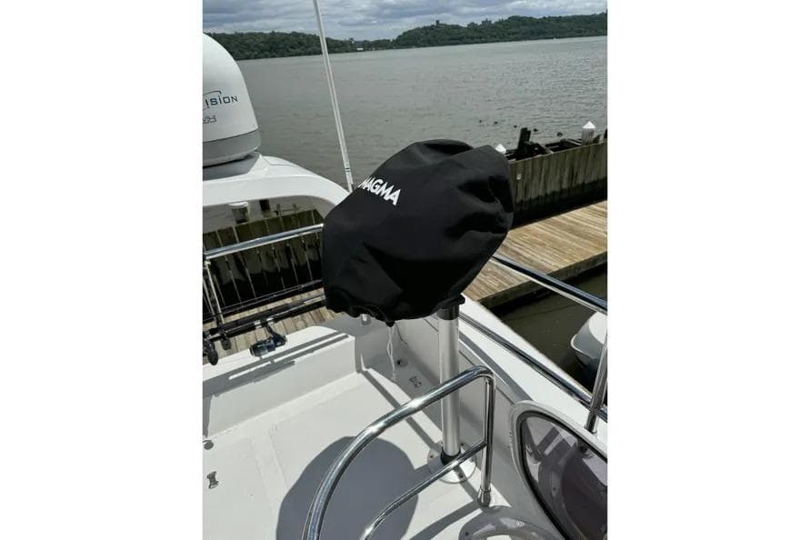 2014 Azimut 45 yacht deck with covered Magma grill by the water.