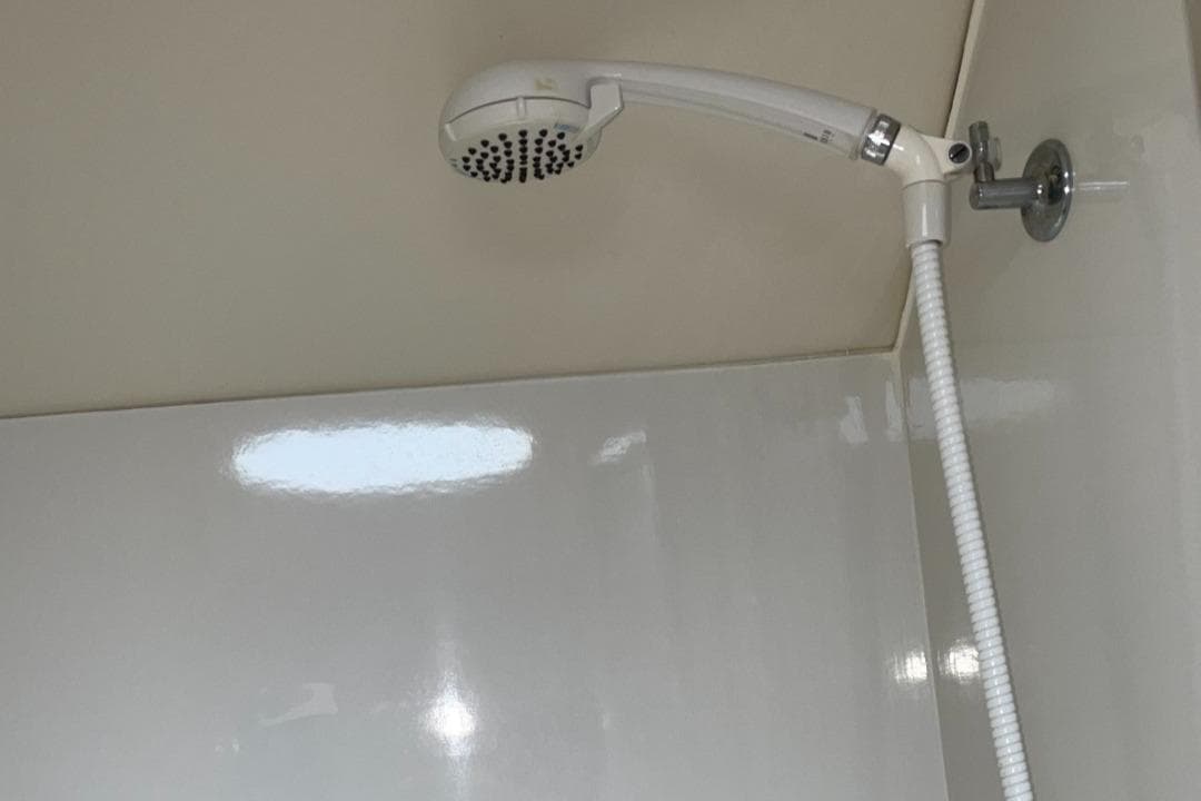 Showerhead in the bathroom of a 1999 Bayliner 3388 Motoryacht.