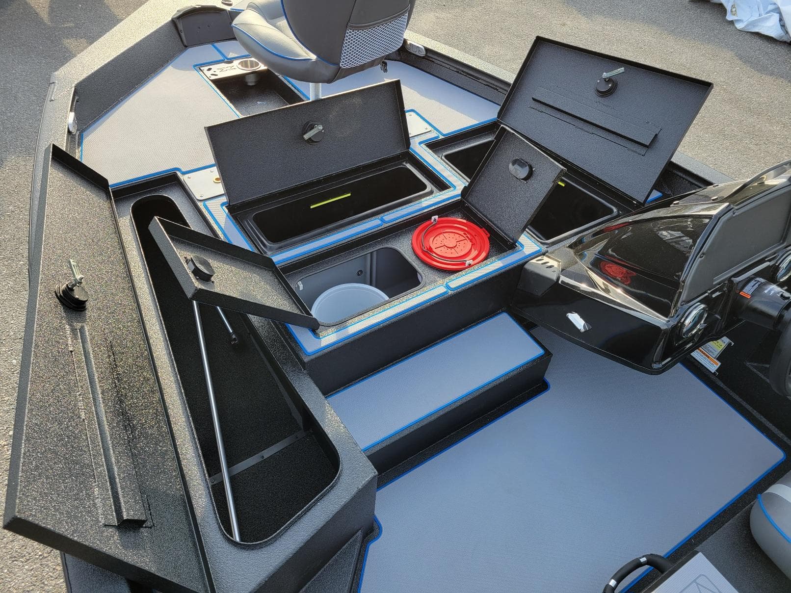 2025 Xpress H17C Crappie boat interior with open storage compartments.