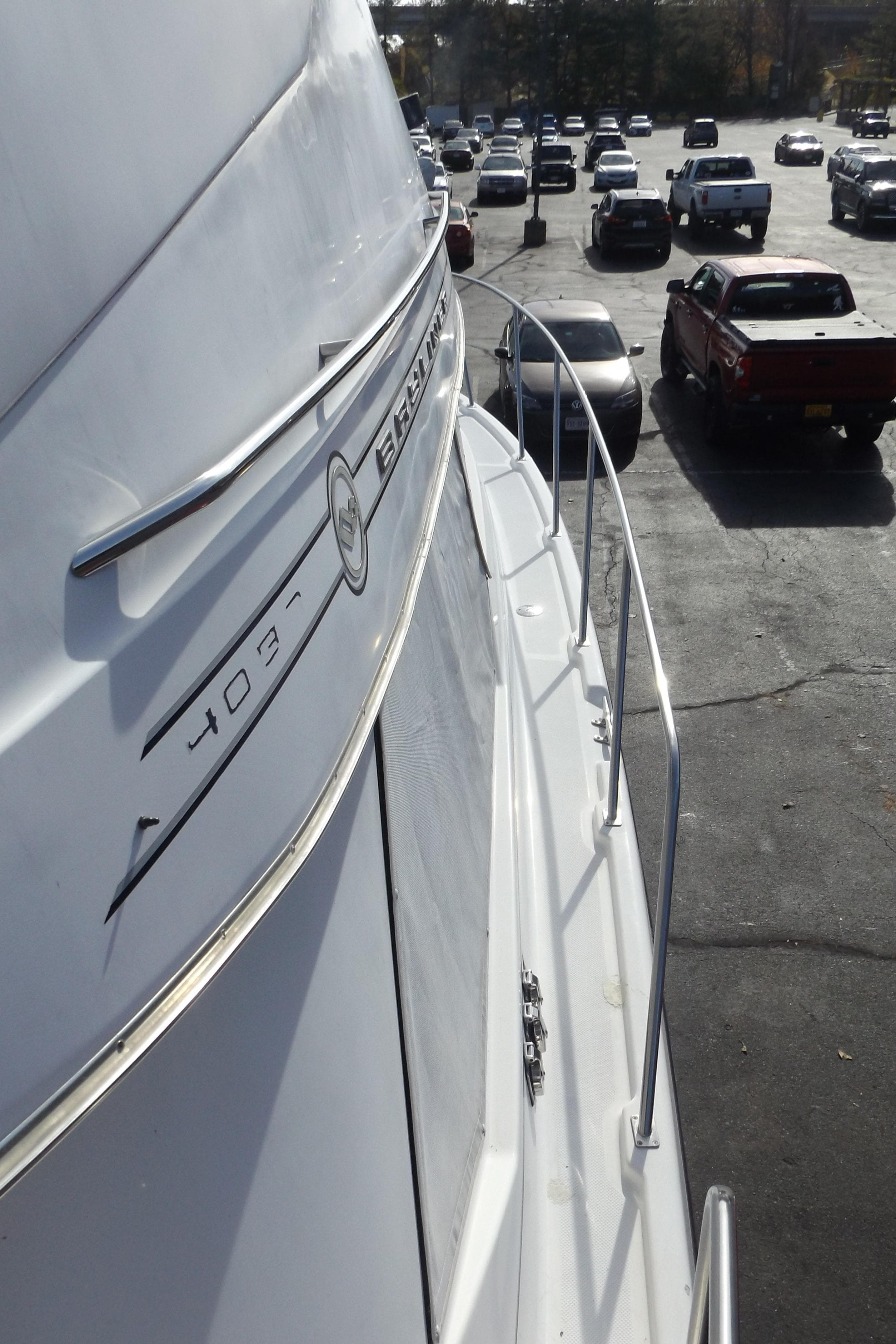 2000 Bayliner 4087 Aft Cabin Motoryacht parked in a busy lot, side view.